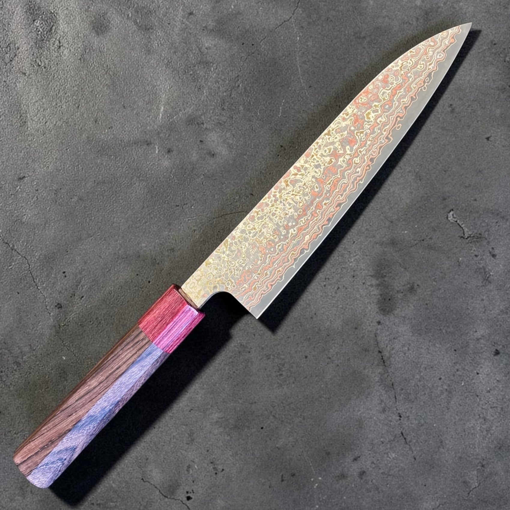 Takeshi Saji VG-10W Nashiji Rainbow Gyuto 180mm with octagonal rosewood handle and red wood ferrule, angled full knife view.