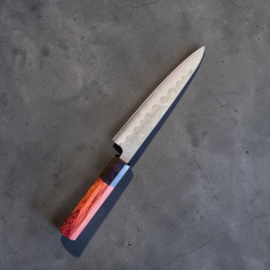 Tokushu Ginsan #3 Nashiji Petty 135mm, angled view showing the nashiji finish and rosewood ebony handle.