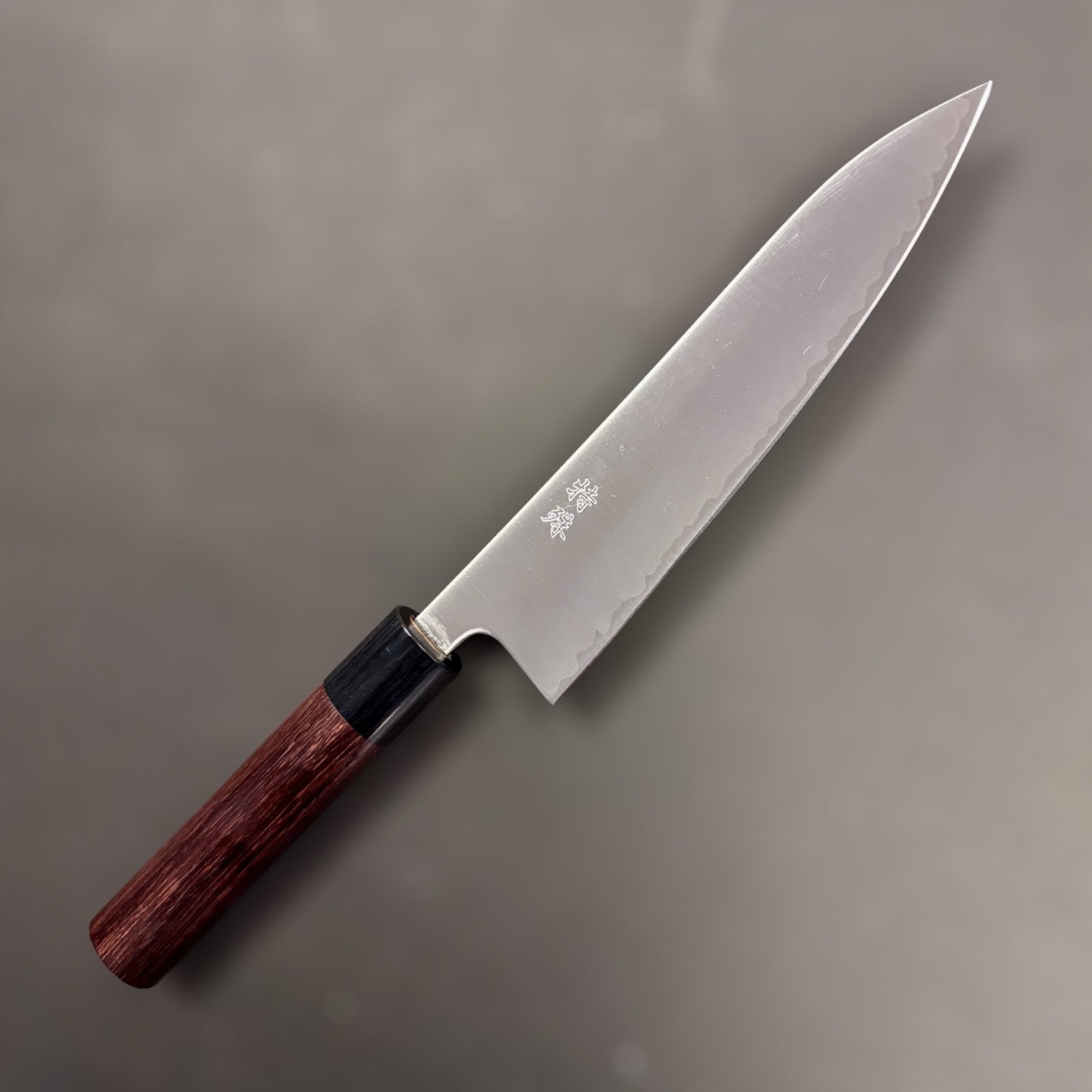 Tokushu Knife Aogami Super Migaki Gyuto 180 mm, right blade face showing hamon line and octagonal handle.