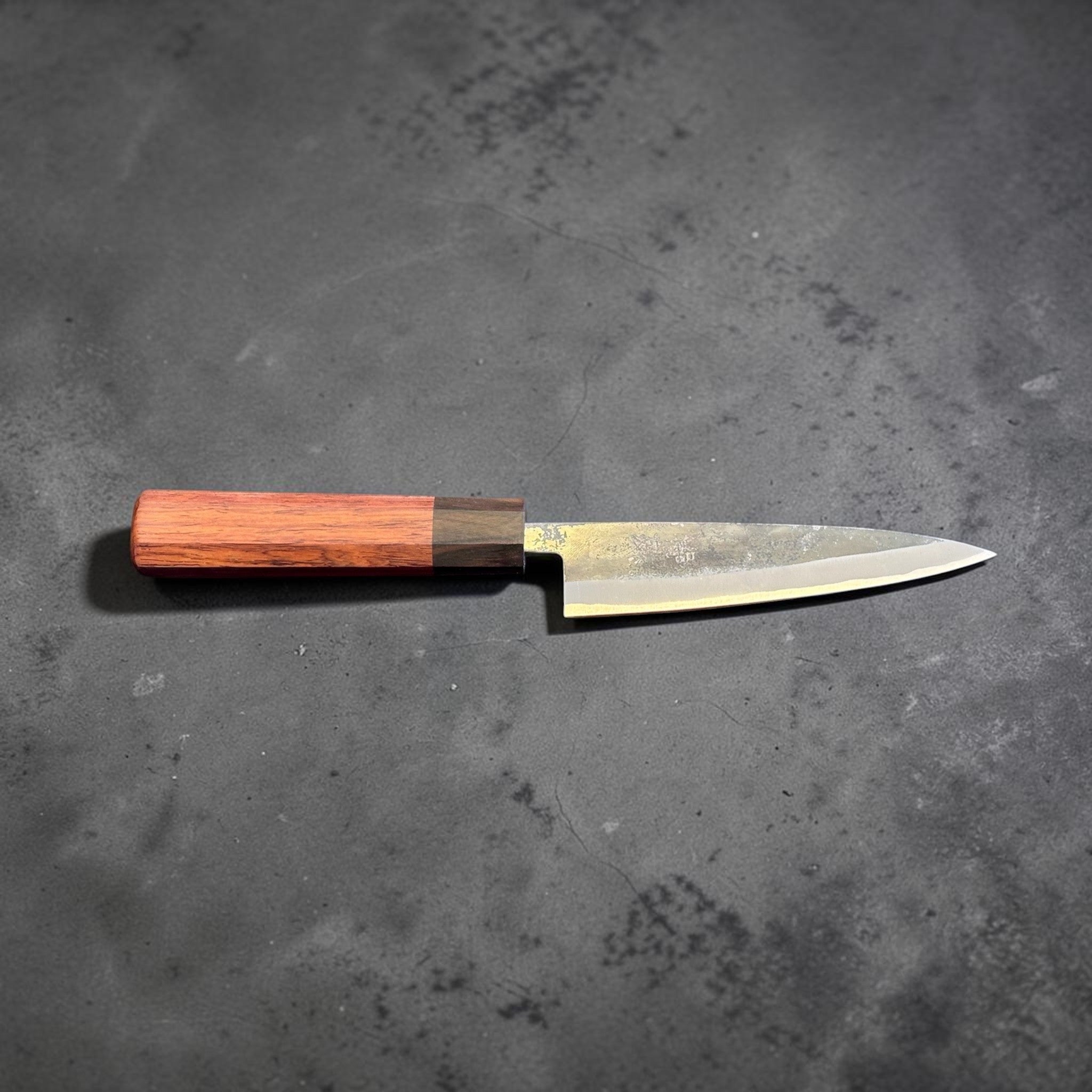 Tokushu Knife Rosewood Series White #2 Kurouchi 135 mm Japanese petty knife, full side profile showing the narrow petty blade and rosewood handle.
