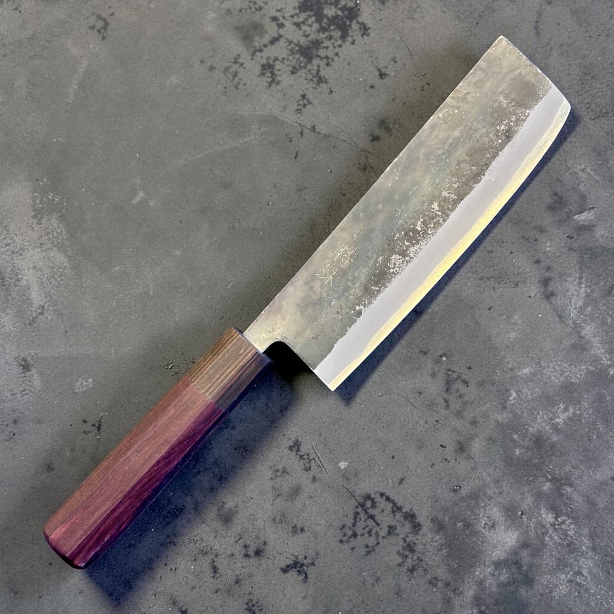 Tokushu Knife Rosewood Series White #2 Kurouchi 165 mm Japanese nakiri knife, angled front view showing kurouchi finish and rosewood wa handle.