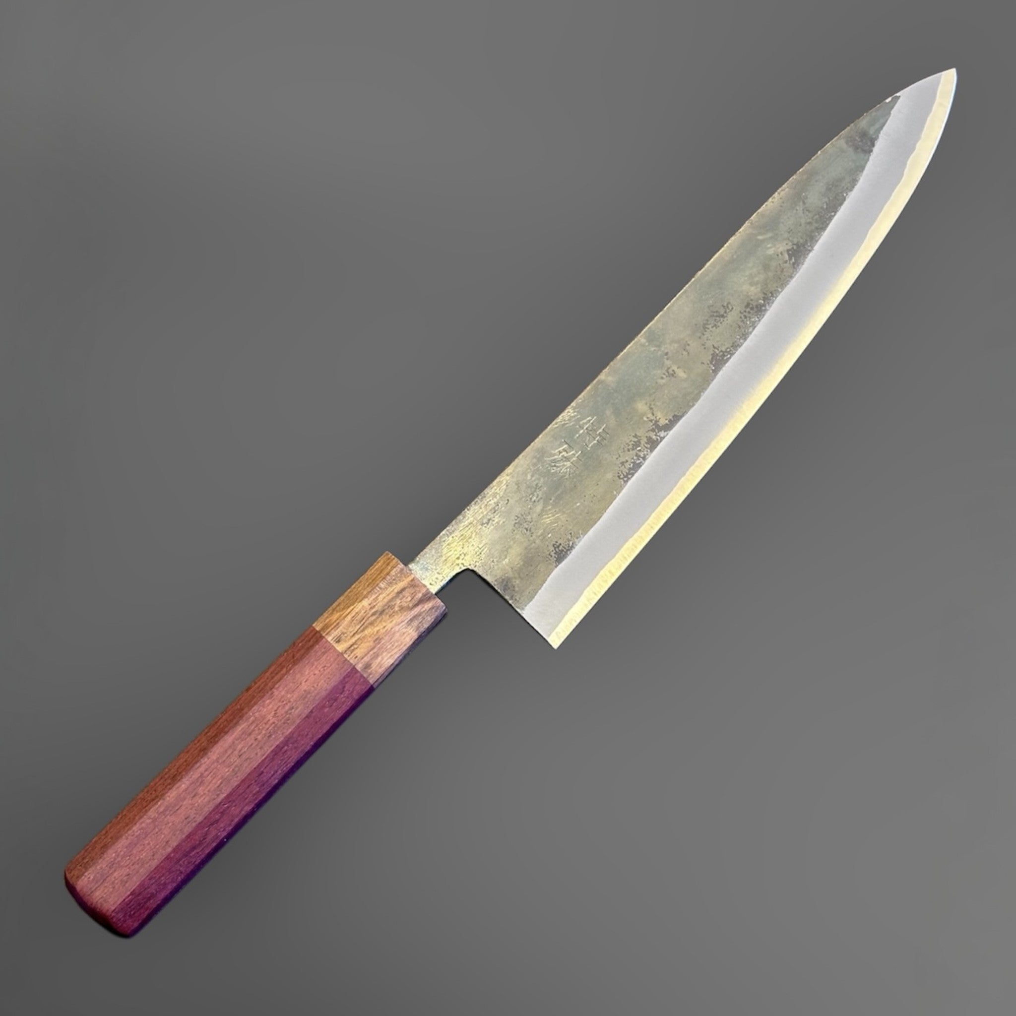 Tokushu Knife Rosewood Series White #2 Kurouchi 210 mm Japanese gyuto knife, angled reverse view with kurouchi blade finish and rosewood wa handle.