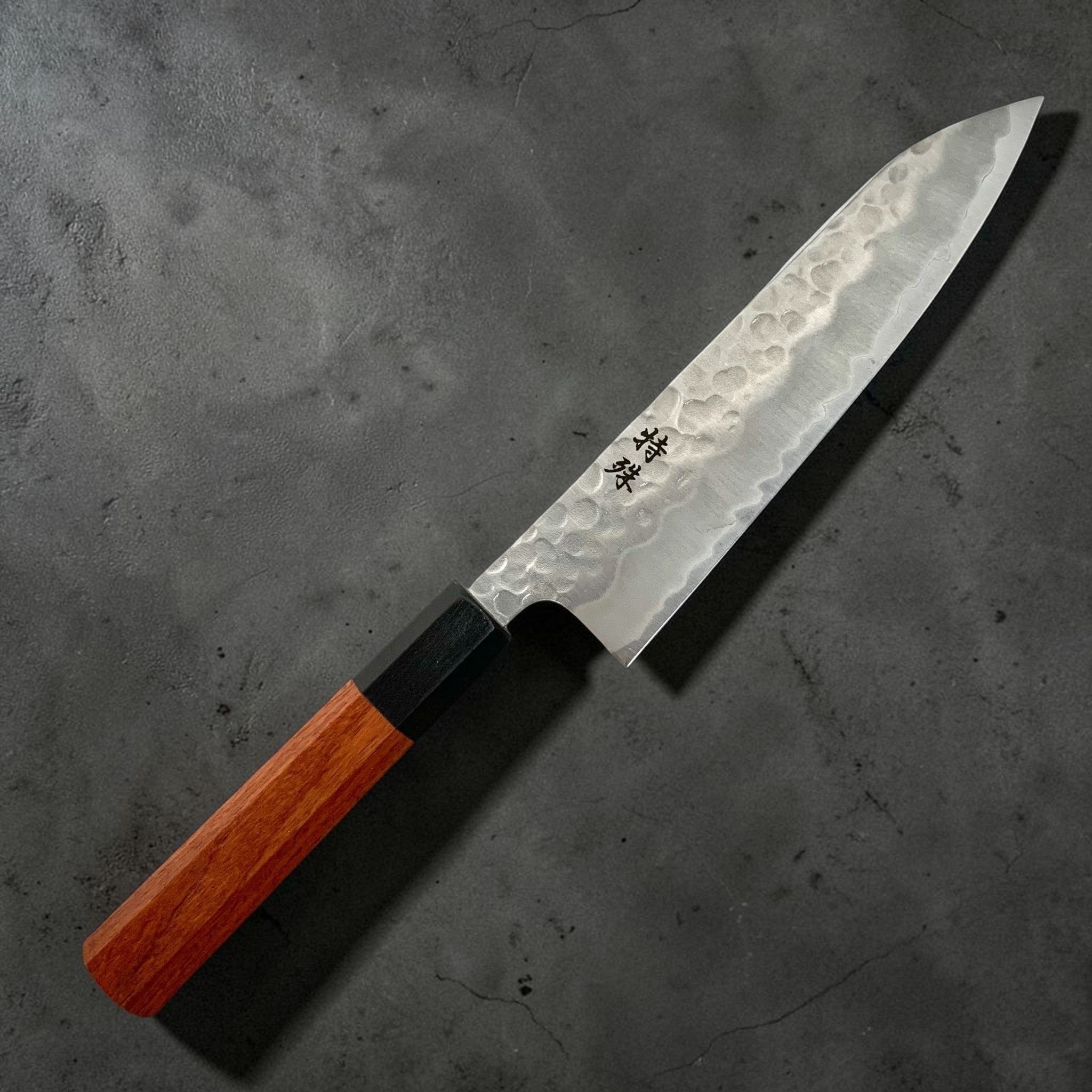 Tokushu Knife White #2 Stainless Clad Tsuchime Gyuto 180 mm — front angle showing hammer‑textured blade and octagonal rosewood handle.