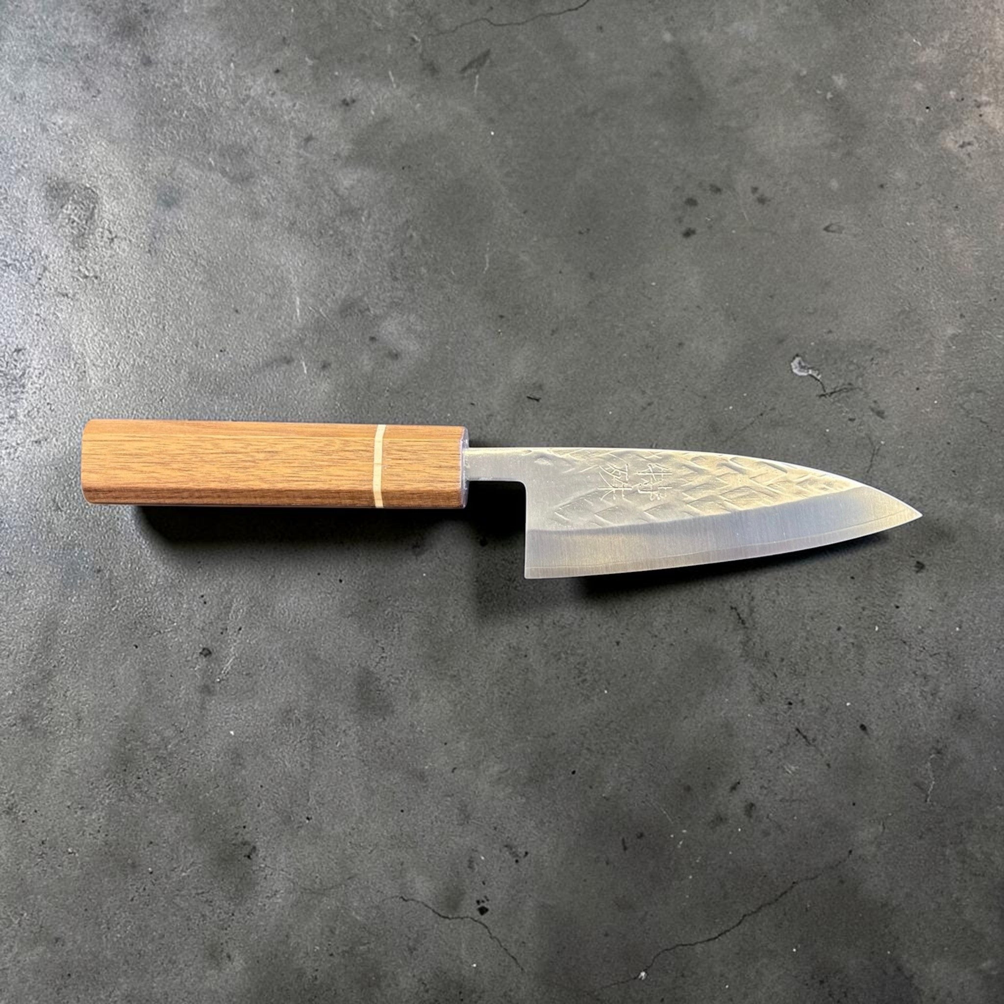 Tokushu Knife Tsuchime SLD 105 mm Tall Petty Ajikiri, reverse profile view with engraved kanji, hammered blade texture, and wooden wa handle.