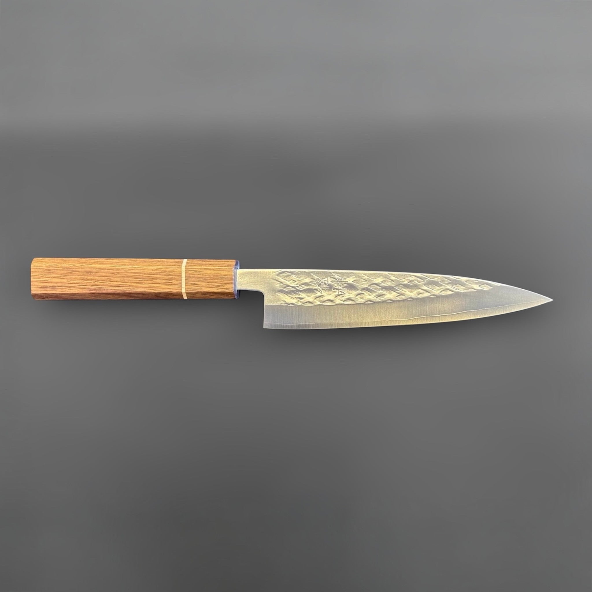Tokushu Knife Tsuchime SLD 165 mm Hiraki Petty, full profile view showing the long petty blade, hammered tsuchime finish, and wood wa handle.