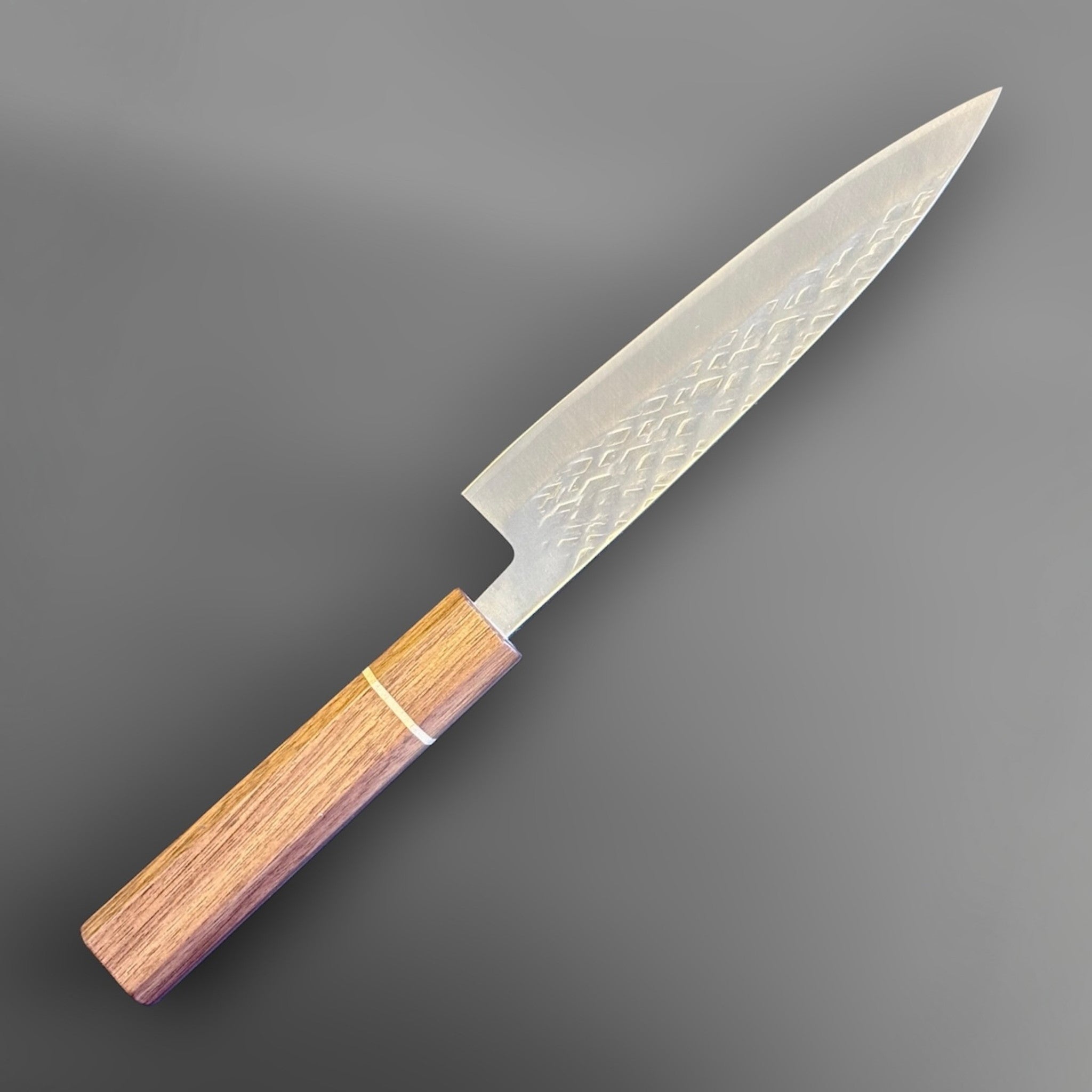 Tokushu Knife Tsuchime SLD 165 mm Hiraki Petty, angled reverse-side view with engraved kanji, hammered blade texture, and clean edge line.