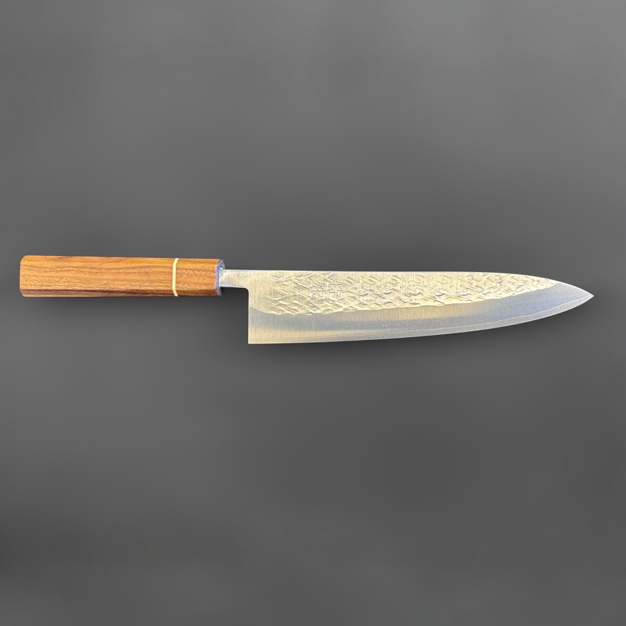 Tokushu Knife Tsuchime SLD Gyuto 210 mm, full profile view highlighting the long gyuto shape, tsuchime finish, and wood wa handle.