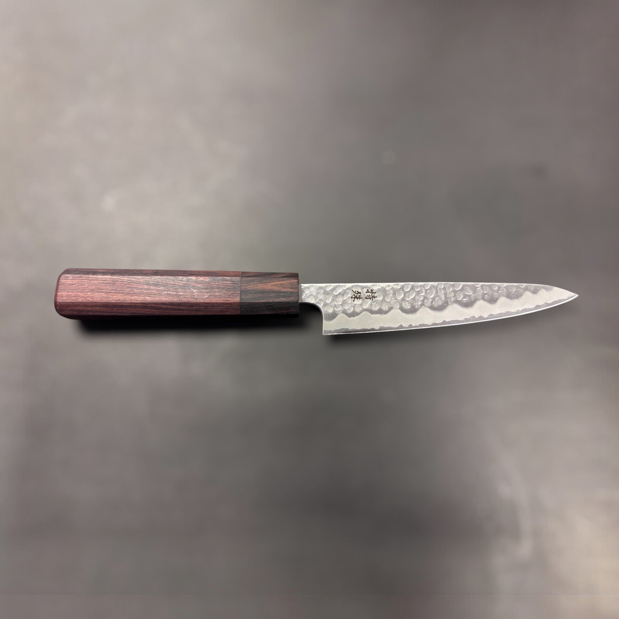 Tokushu Tsuchime White #2 Petty 135 mm with rosewood wa handle, overhead view of full knife showing entire profile