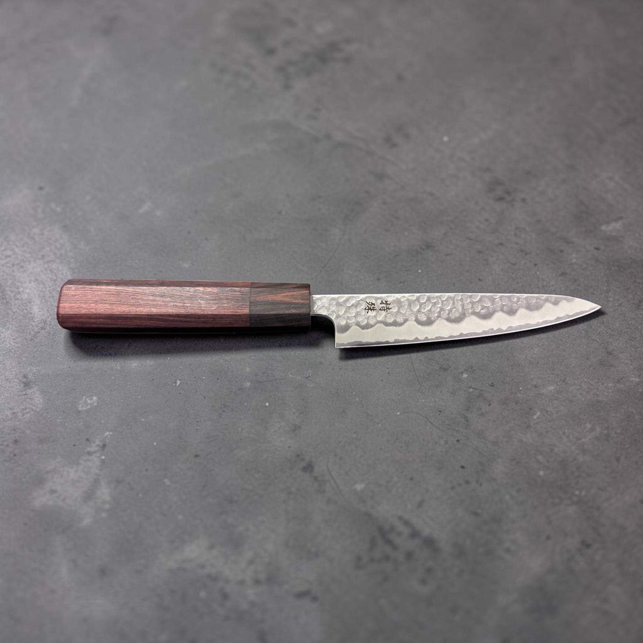 Tokushu Tsuchime White #2 Petty 135 mm with rosewood wa handle, overhead view of full knife showing entire profile