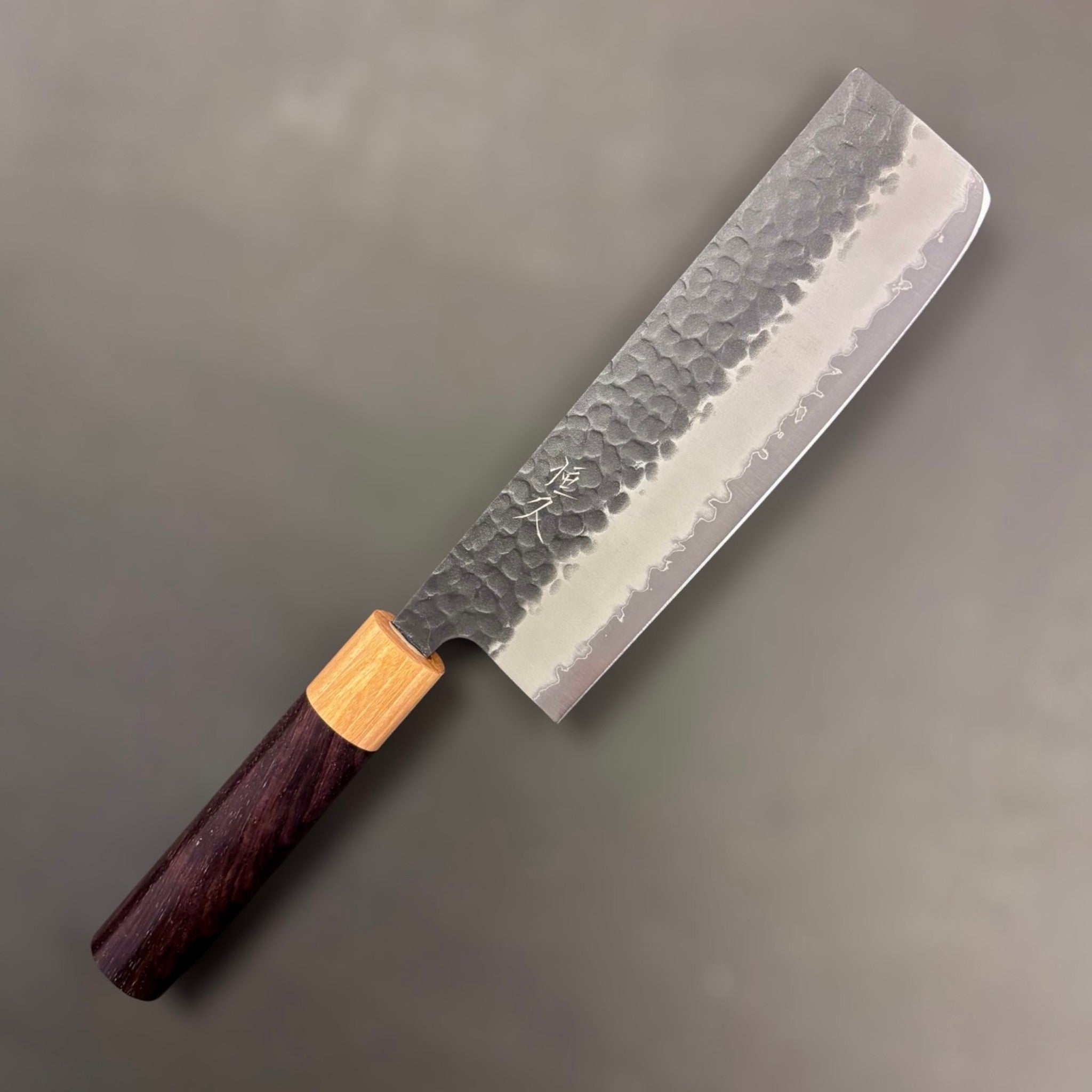 Tsunehisa Aogami Super Kurouchi Tsuchime Nakiri 165 mm, right-side face with hammered kurouchi finish and kanji near the heel, octagonal wa handle.
