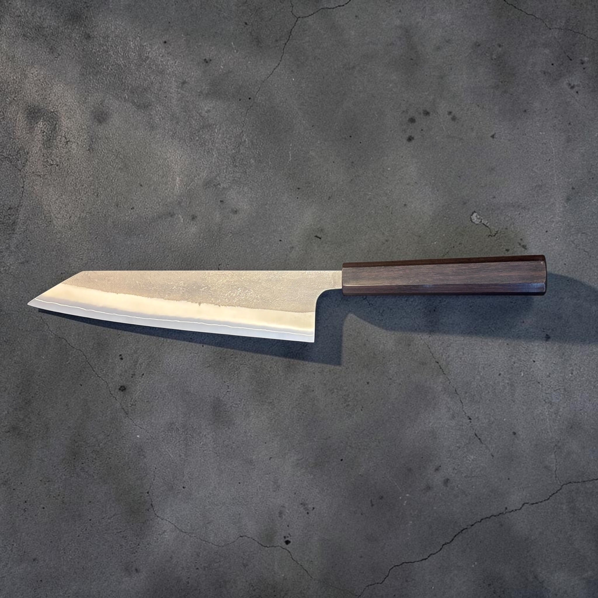 Yoshikane SKD Nashiji Kiritsuke 210mm with mono bubinga handle, full reverse-side profile.