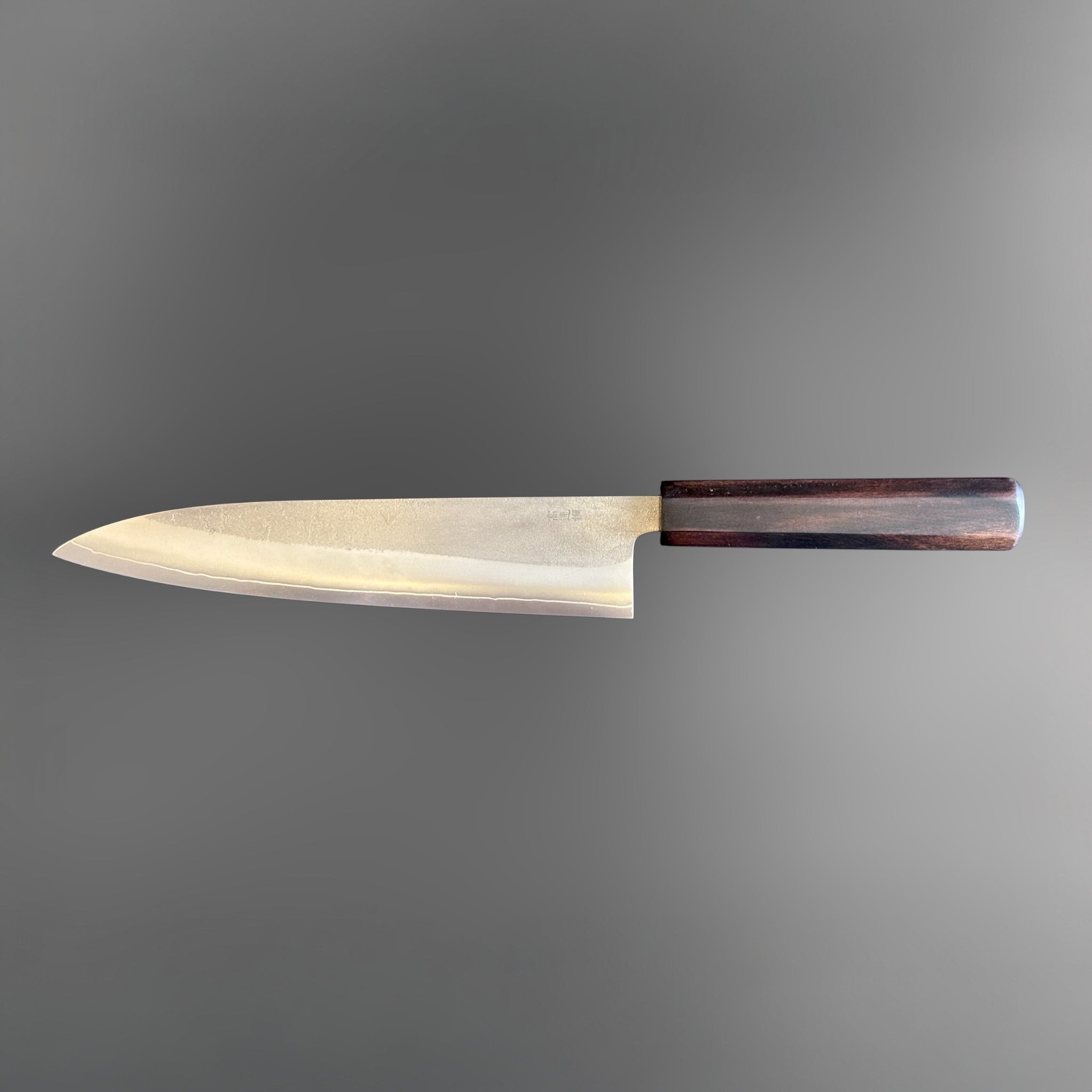 Yoshikane SKD Nashiji Gyuto 210 mm with mono ebony handle, reverse full side profile showing thin edge line.