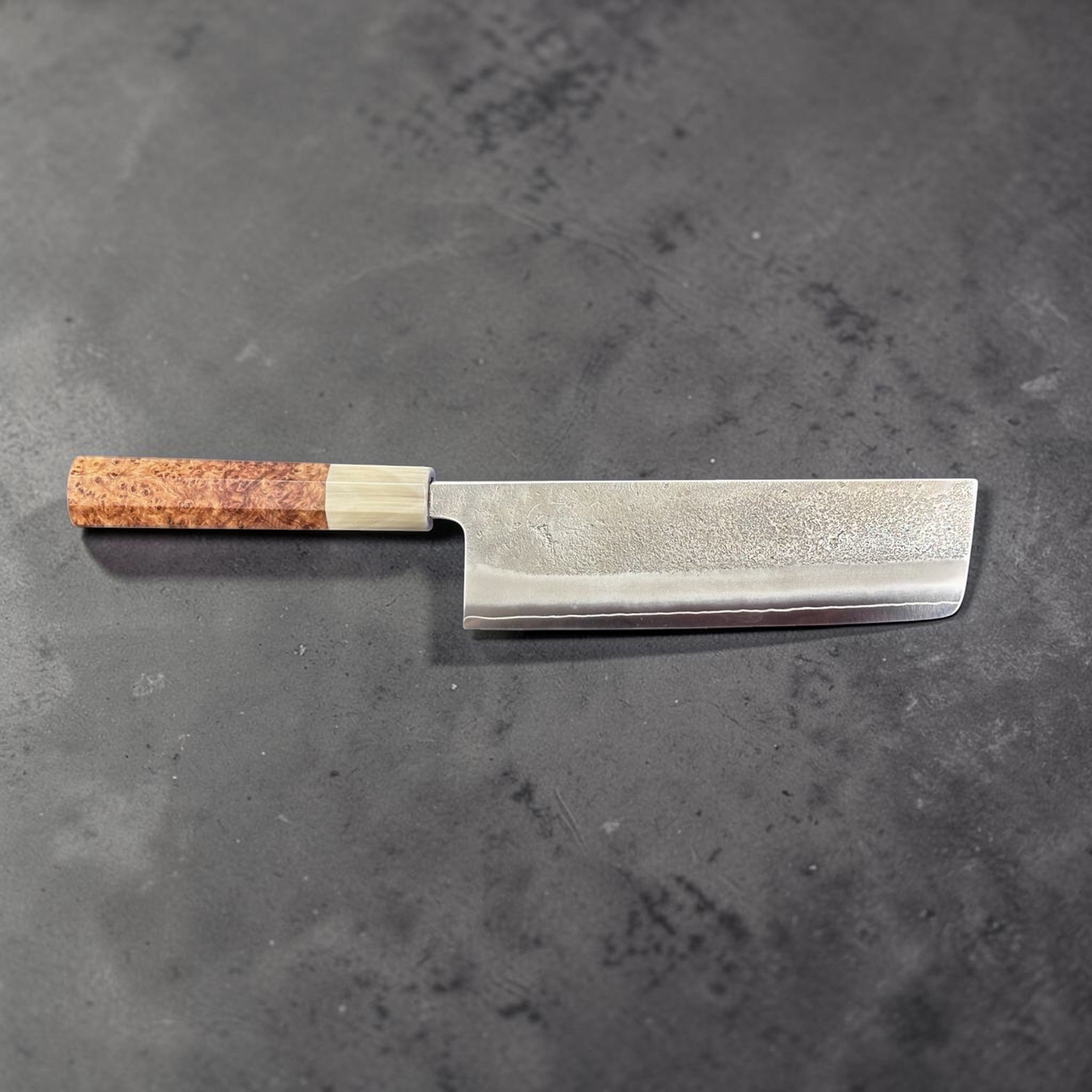 Yoshikane SKD Nashiji Nakiri with amboyna burl handle, full side profile of the blade and handle.