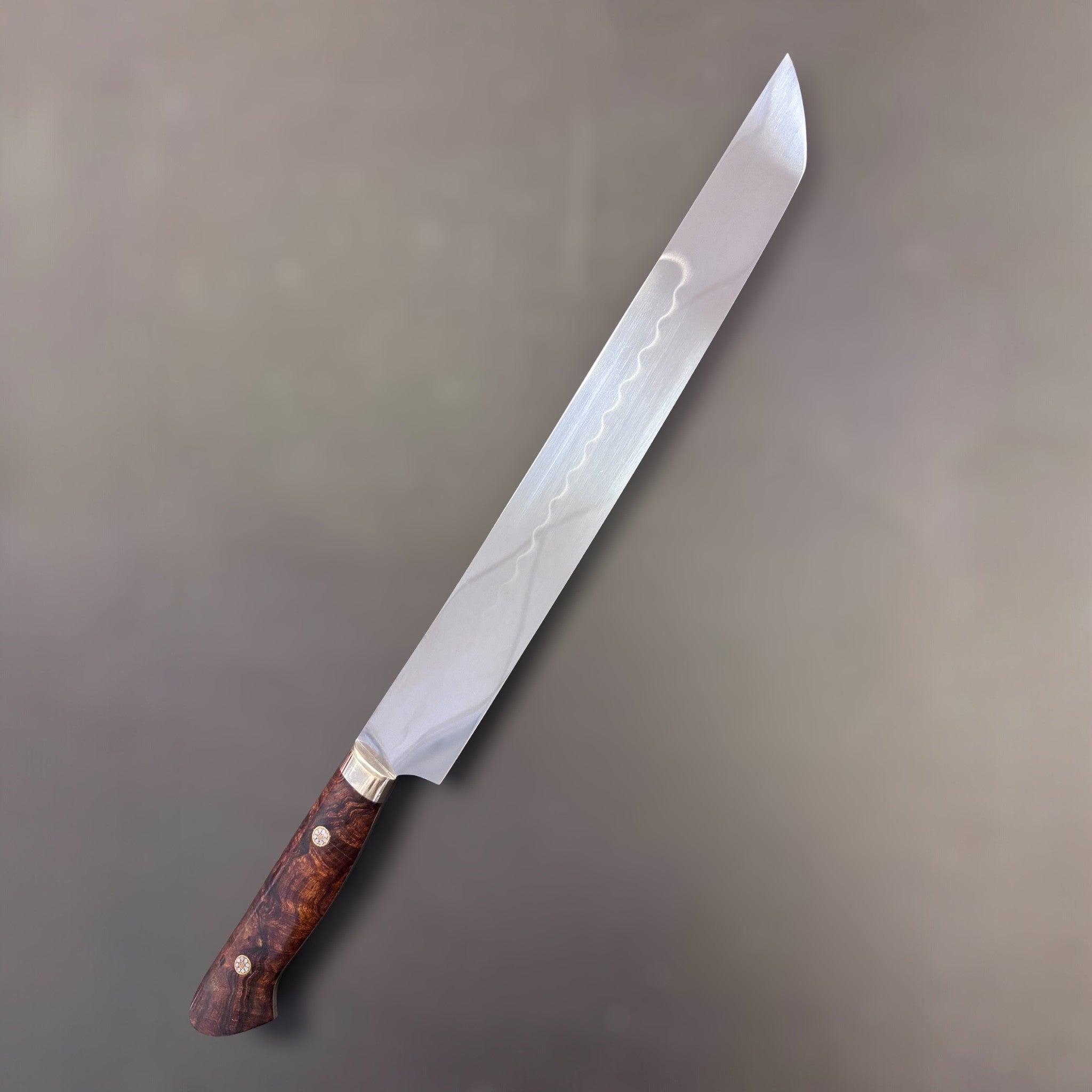 Yoshikazu Ikeda White #2 Honyaki Sakimaru Sujihiki 270 mm, front side with visible hamon and stabilized burl Western handle.