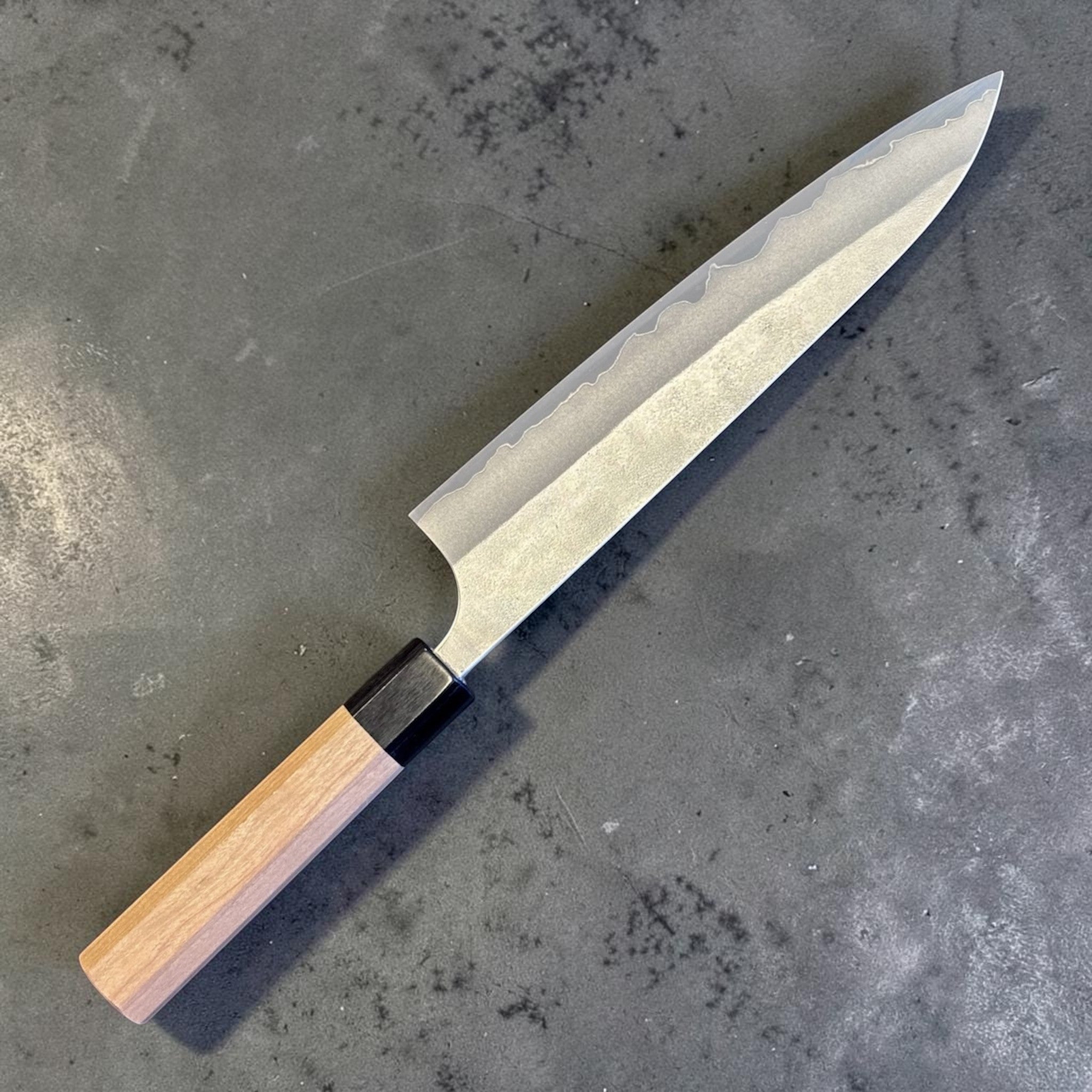 Yoshimi Kato Aogami Super Nashiji Gyuto 210 mm, left sided angled close-up showing Nashiji finish and blade profile.