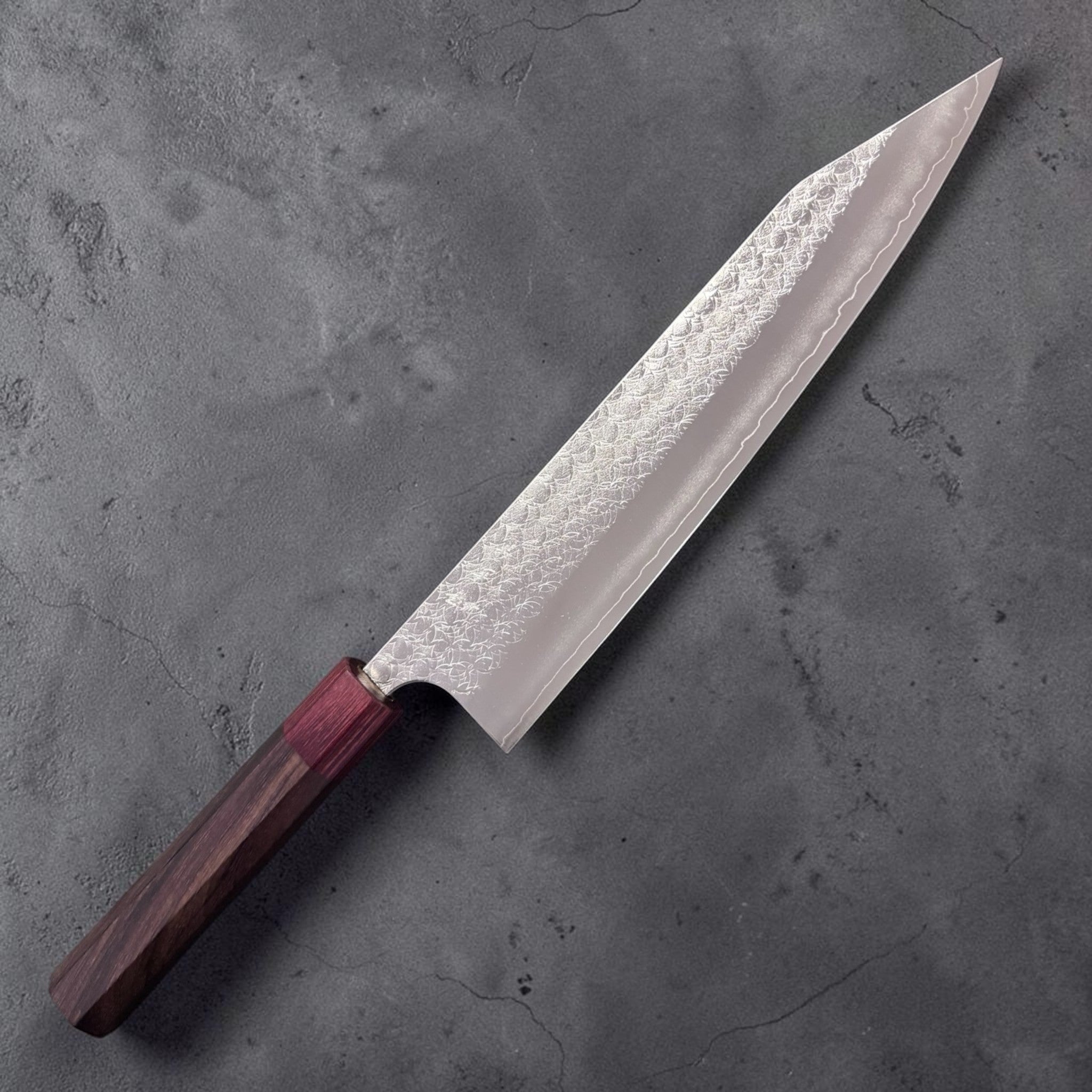 Yoshimi Kato Minamo SG2 Kiritsuke 240 mm, hero angle of the blade face showing the Minamo pattern and crisp kiritsuke tip.