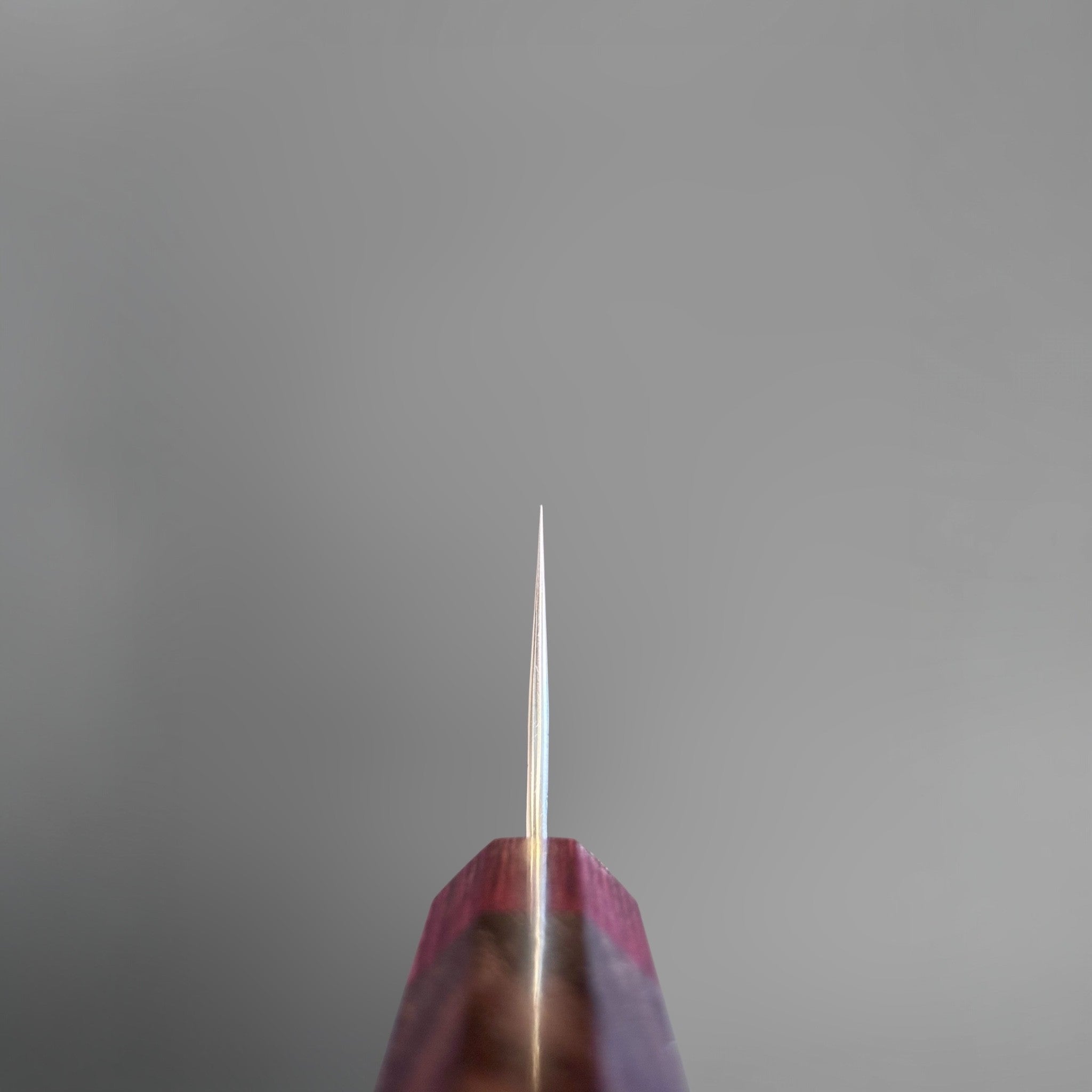 Yoshimi Kato Minamo SG2 Gyuto 210 mm, choil view showing the thin grind and rosewood handle.