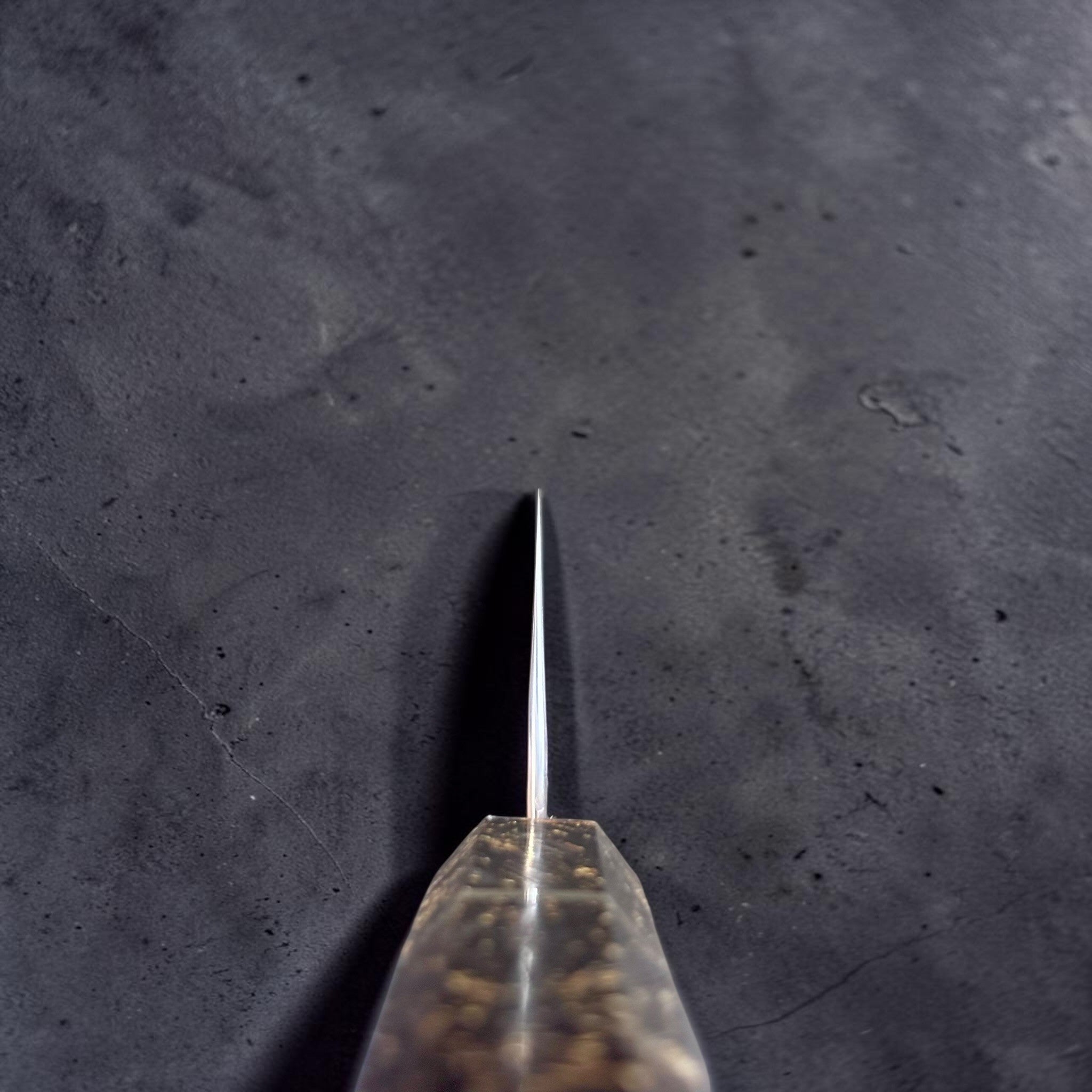 Yoshimi Kato Minamo SG2 Kiritsuke 210 mm with carbon fiber handle, choil view showing thin edge geometry.