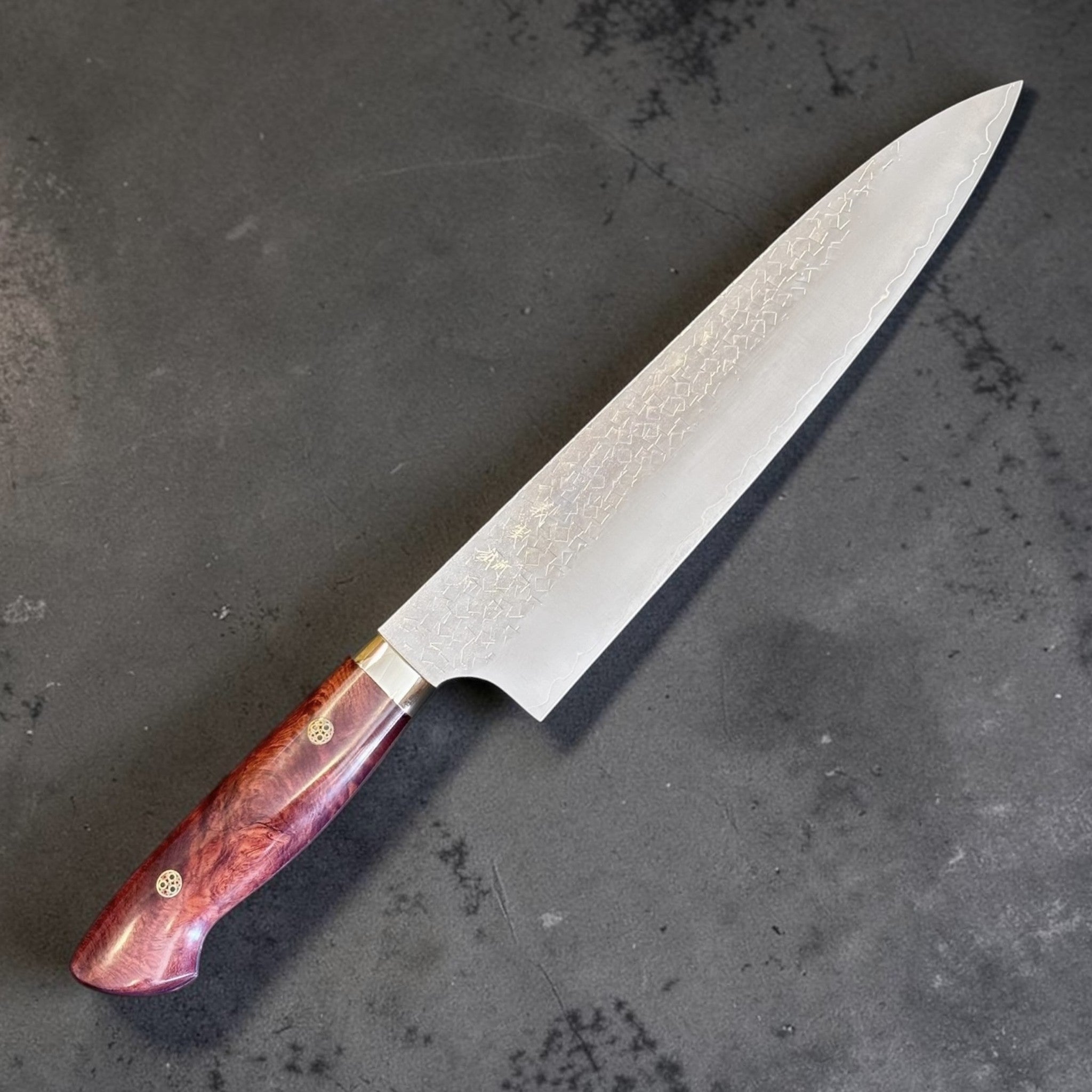Yoshimi Kato SG2 Kaku-Tsuchime Gyuto 210 mm with Karin western handle, angled hero view of blade and handle.