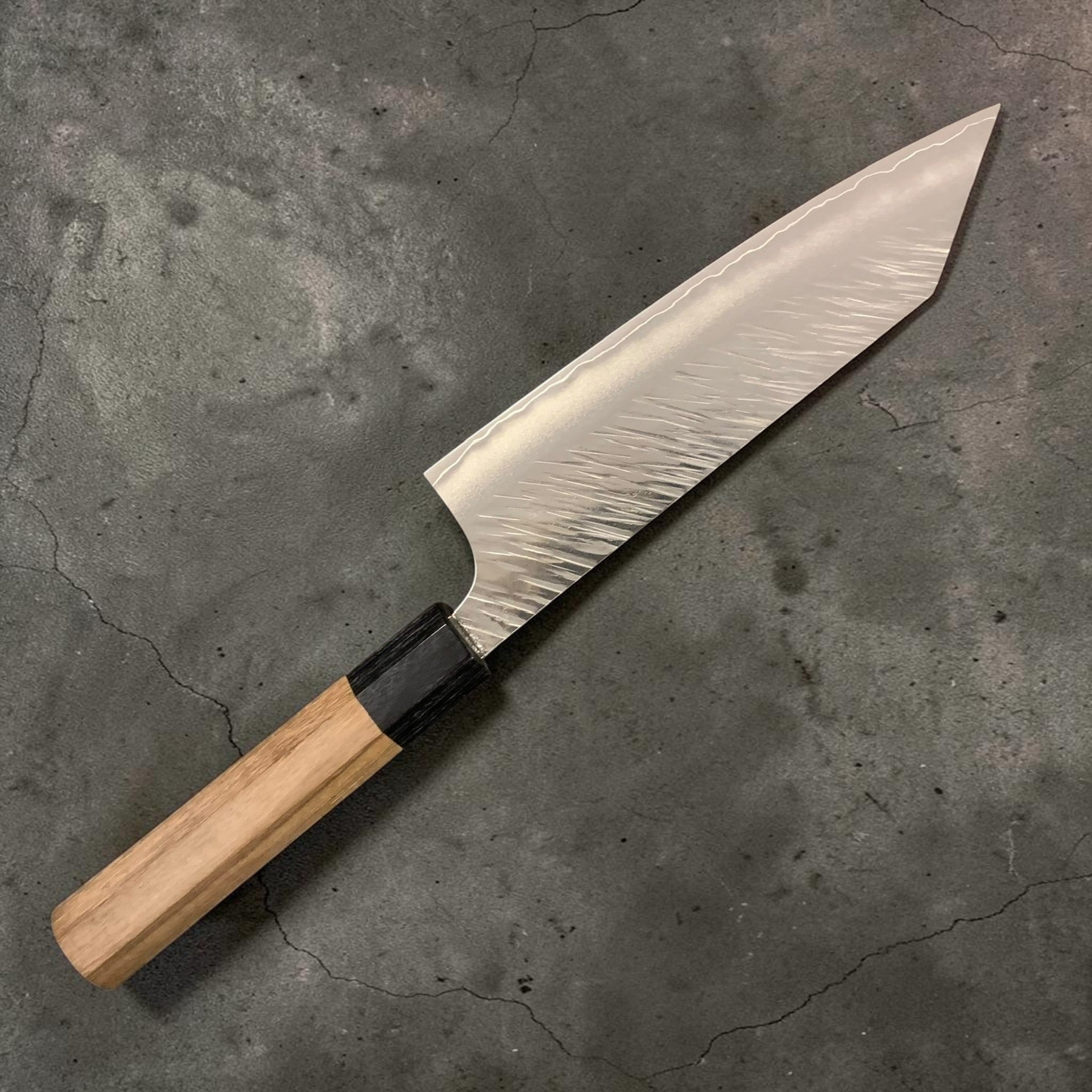 Yu Kurosaki Fujin SG2 Bunka 170 mm, reverse side showing cladding line and hammered texture.