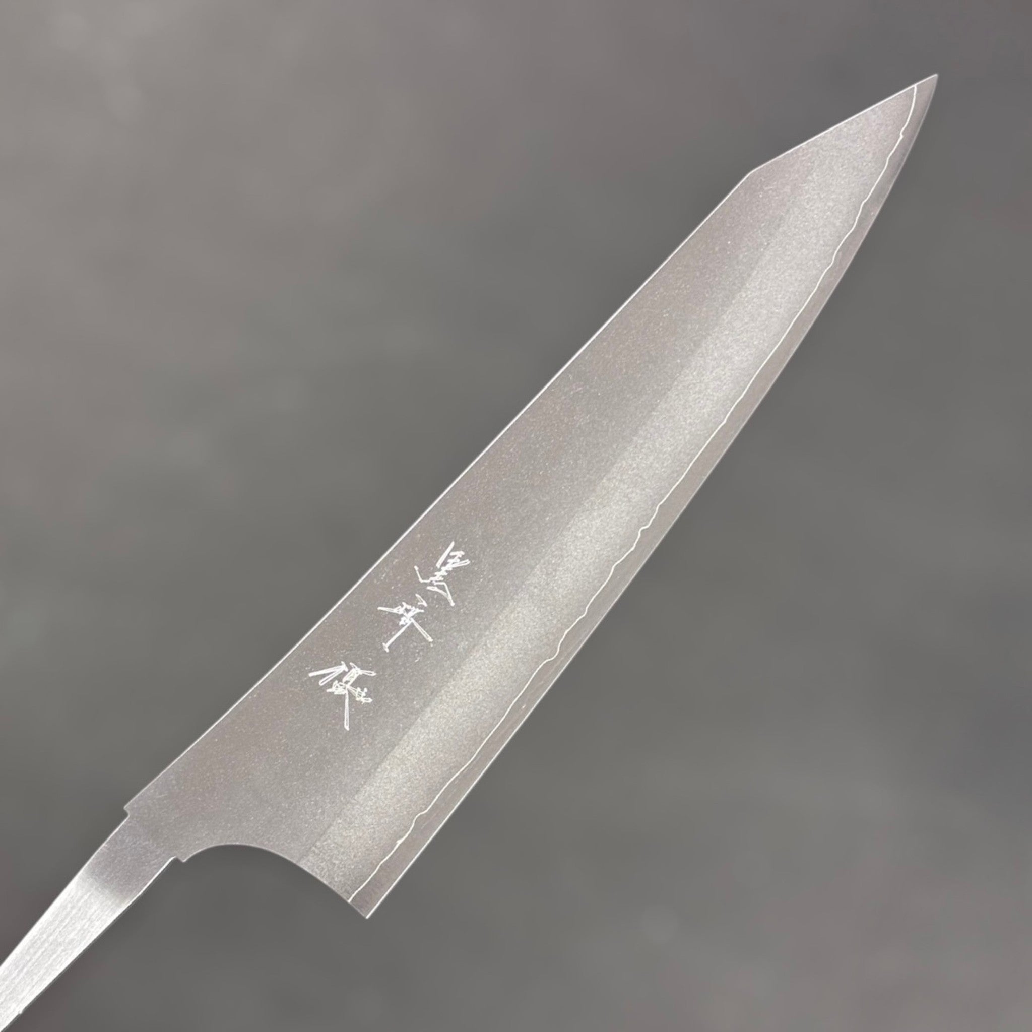 Yu Kurosaki Gekko VG-XEOS Gyuto 210 mm, kanji side of the blade showing the brushed kasumi finish and wavy cladding line near the edge.