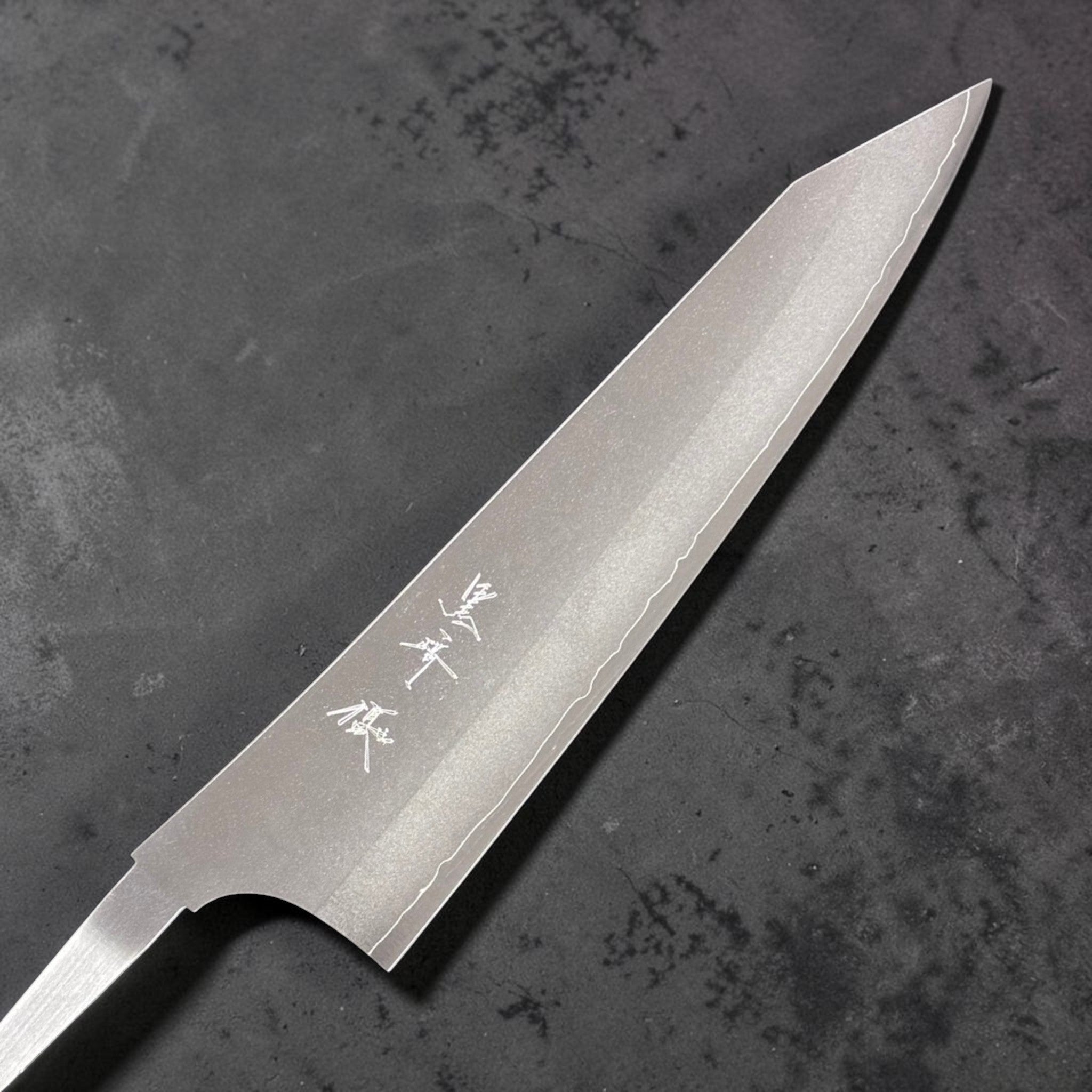 Yu Kurosaki Gekko VG-XEOS Gyuto 210 mm, kanji side of the blade showing the brushed kasumi finish and wavy cladding line near the edge.