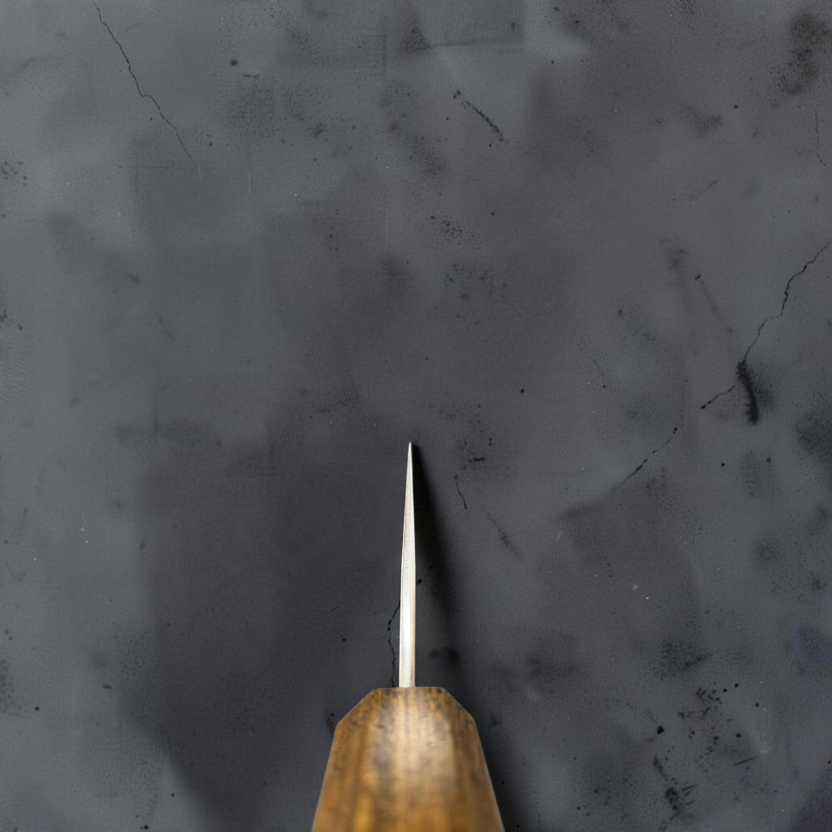 Choil view of the Yu Kurosaki Gekko VG-XEOS gyuto showing the thin grind above the oak handle