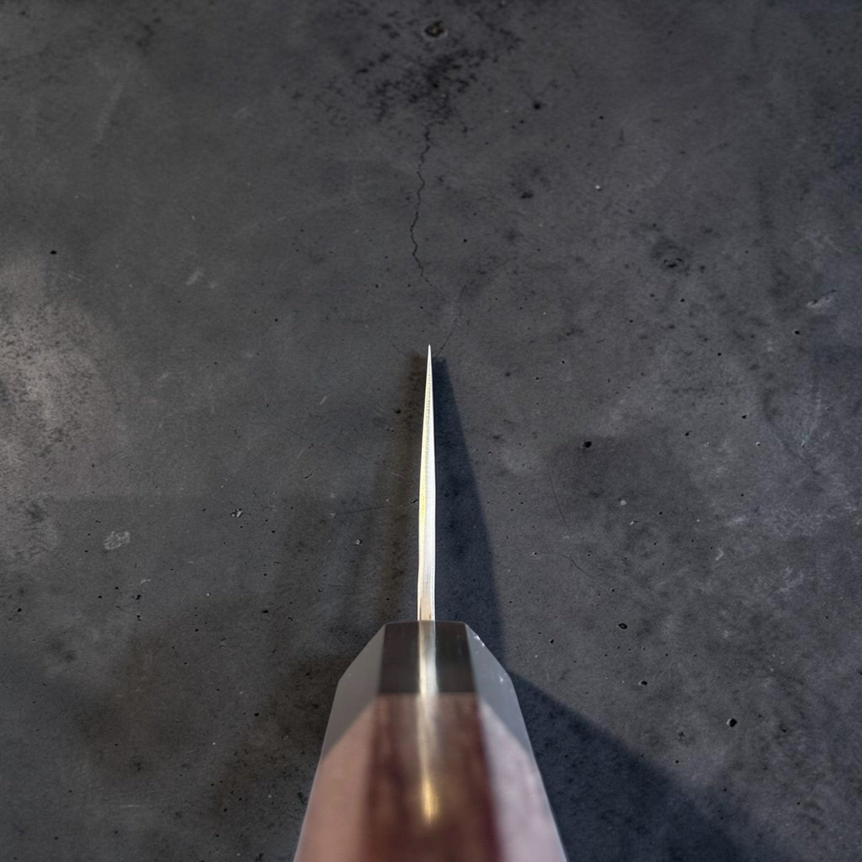 Yu Kurosaki Kokusen AS Gyuto 210mm choil view showing the thin grind and rosewood octagon wa handle