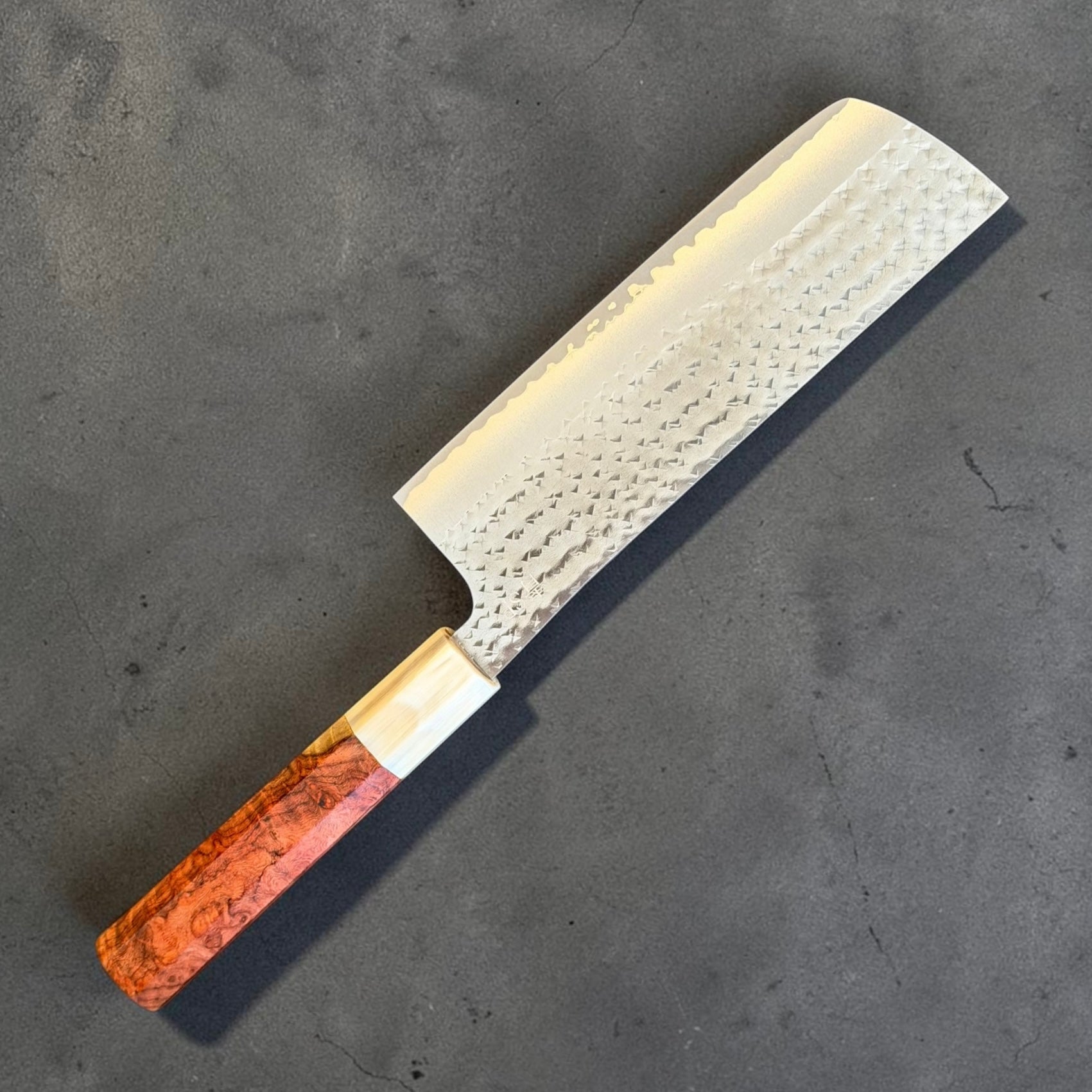 Back face of the Yu Kurosaki Kokusen AS Nakiri 165mm with horn ferrule and Amboyna burl handle
