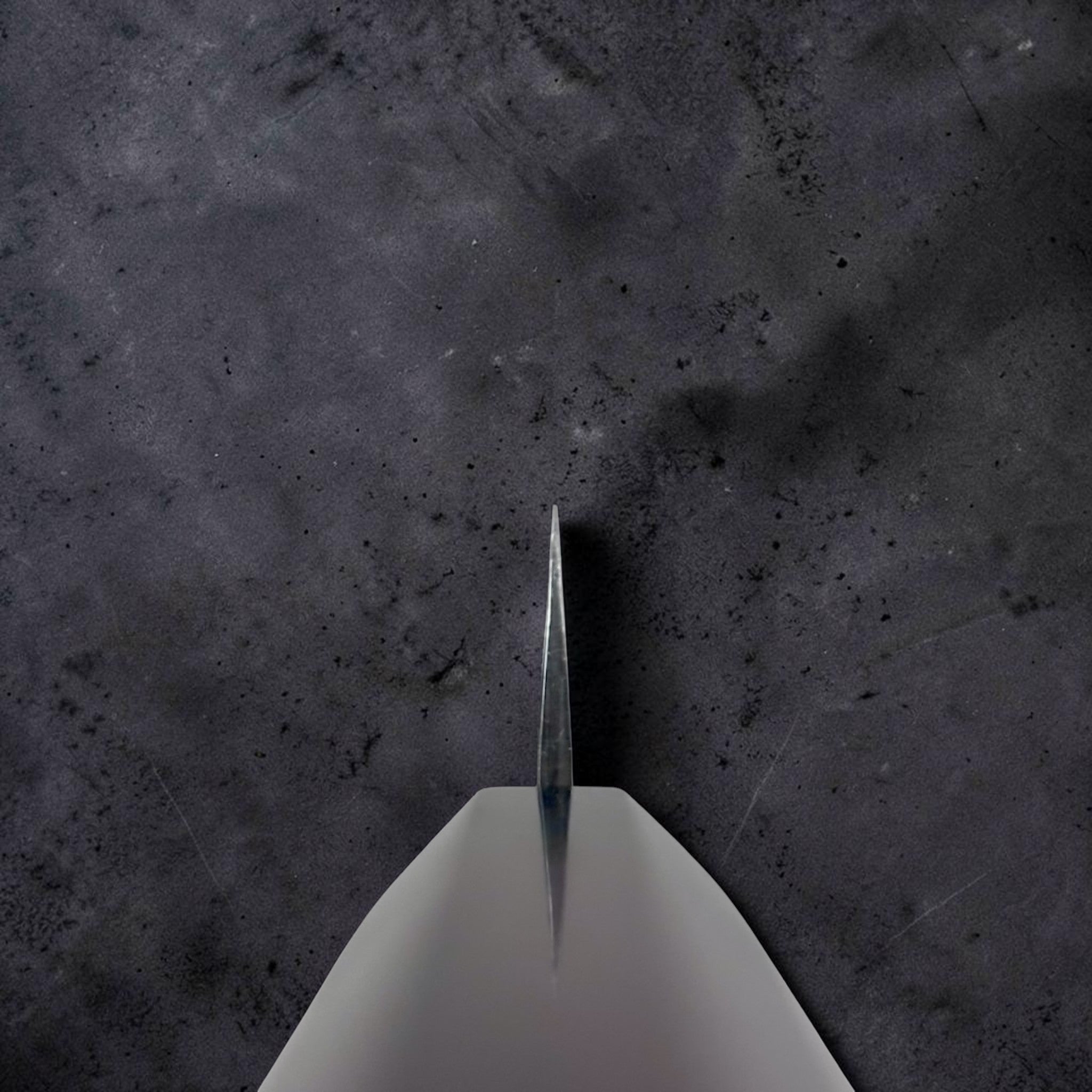 Yu Kurosaki Kokusen AS Petty 120 mm, choil view showing thin blade geometry and edge profile.