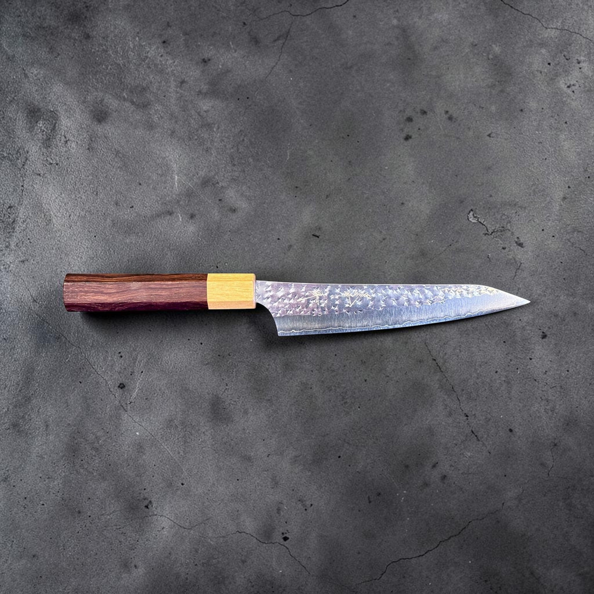 Yu Kurosaki Senko Ei SG2 Petty 150 mm with rosewood octagonal handle, side profile view showing the pointed petty blade.