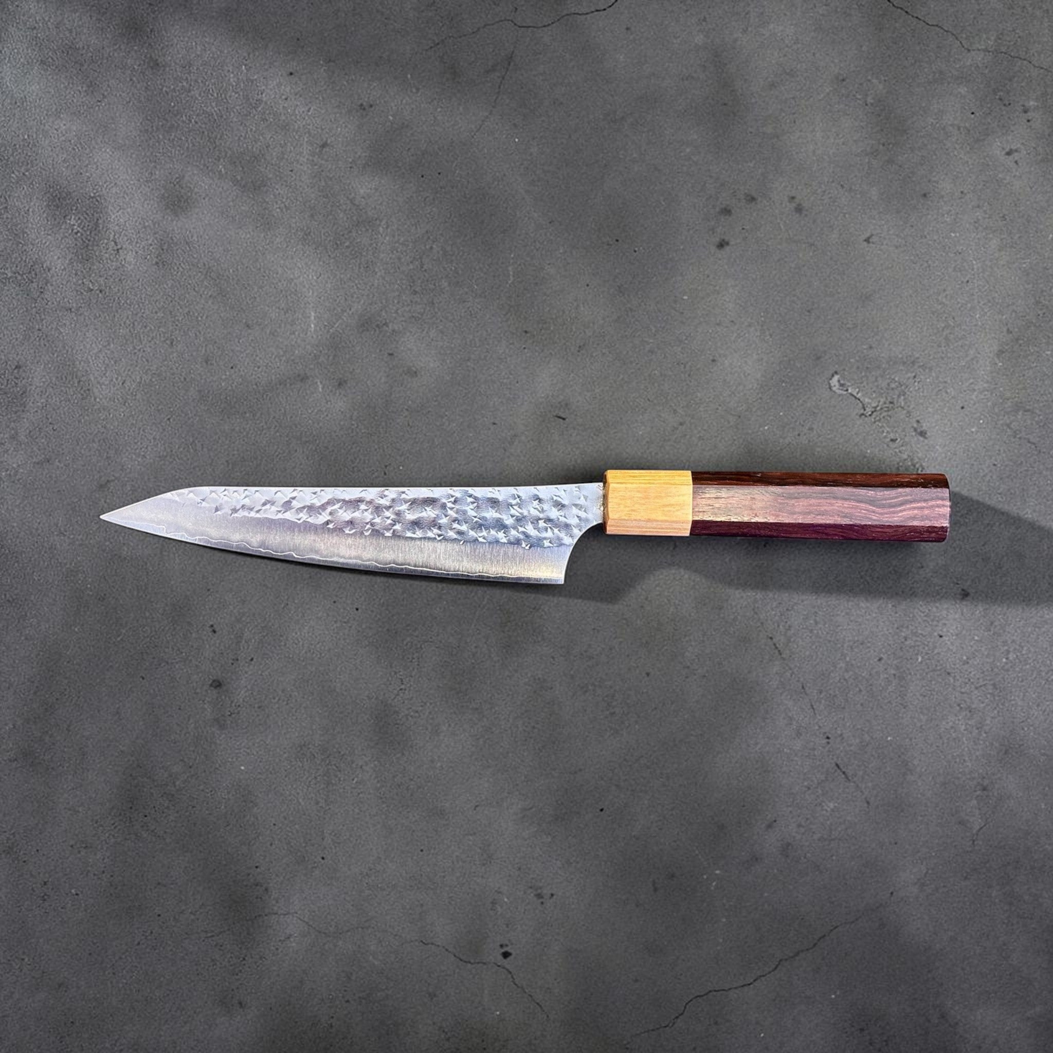 Yu Kurosaki Senko Ei SG2 Petty 150 mm with rosewood octagonal handle, reverse side profile on gray background.