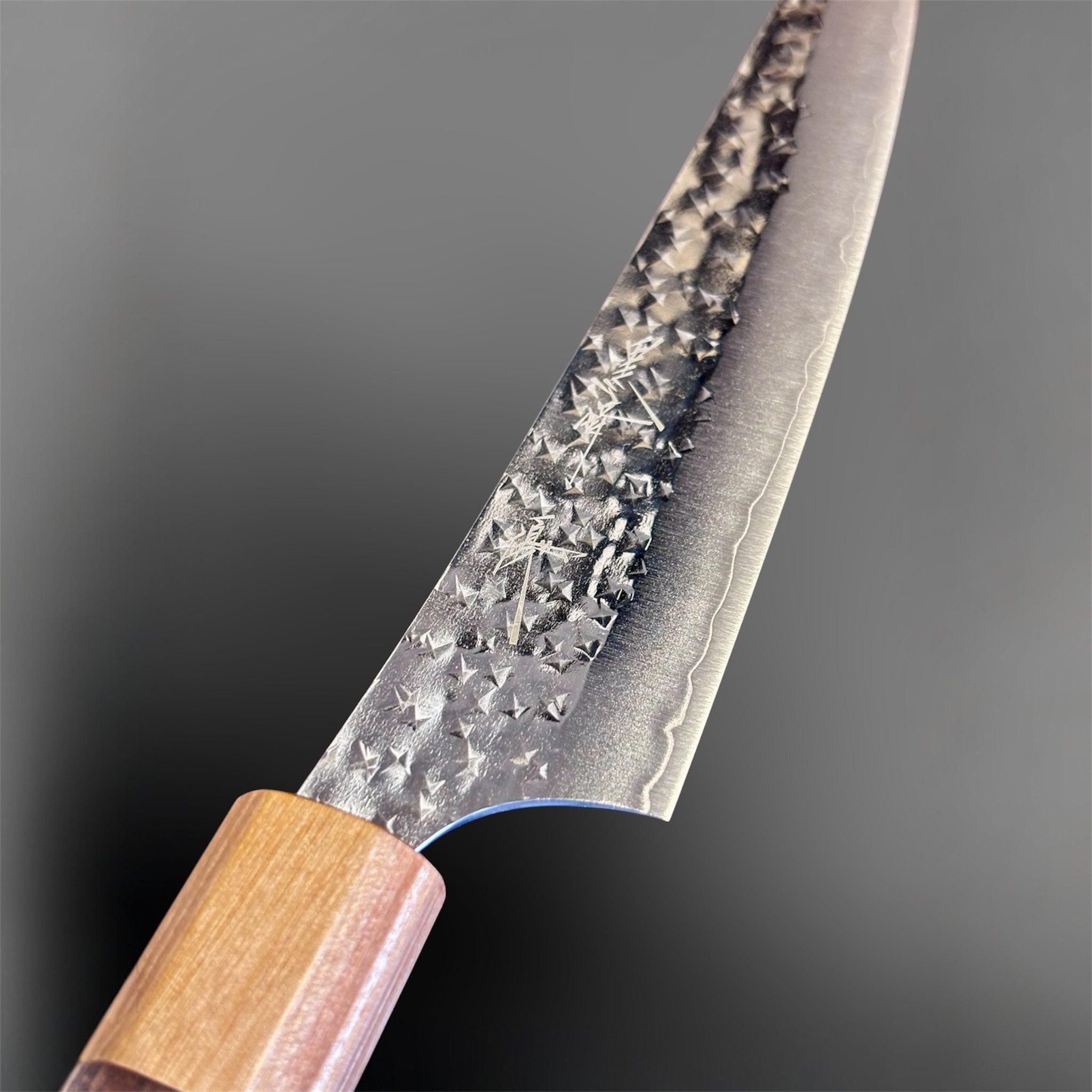 Yu Kurosaki Senko Ei SG2 Petty 150 mm, close-up of the hammered SG2 blade face and kanji detail near the handle.