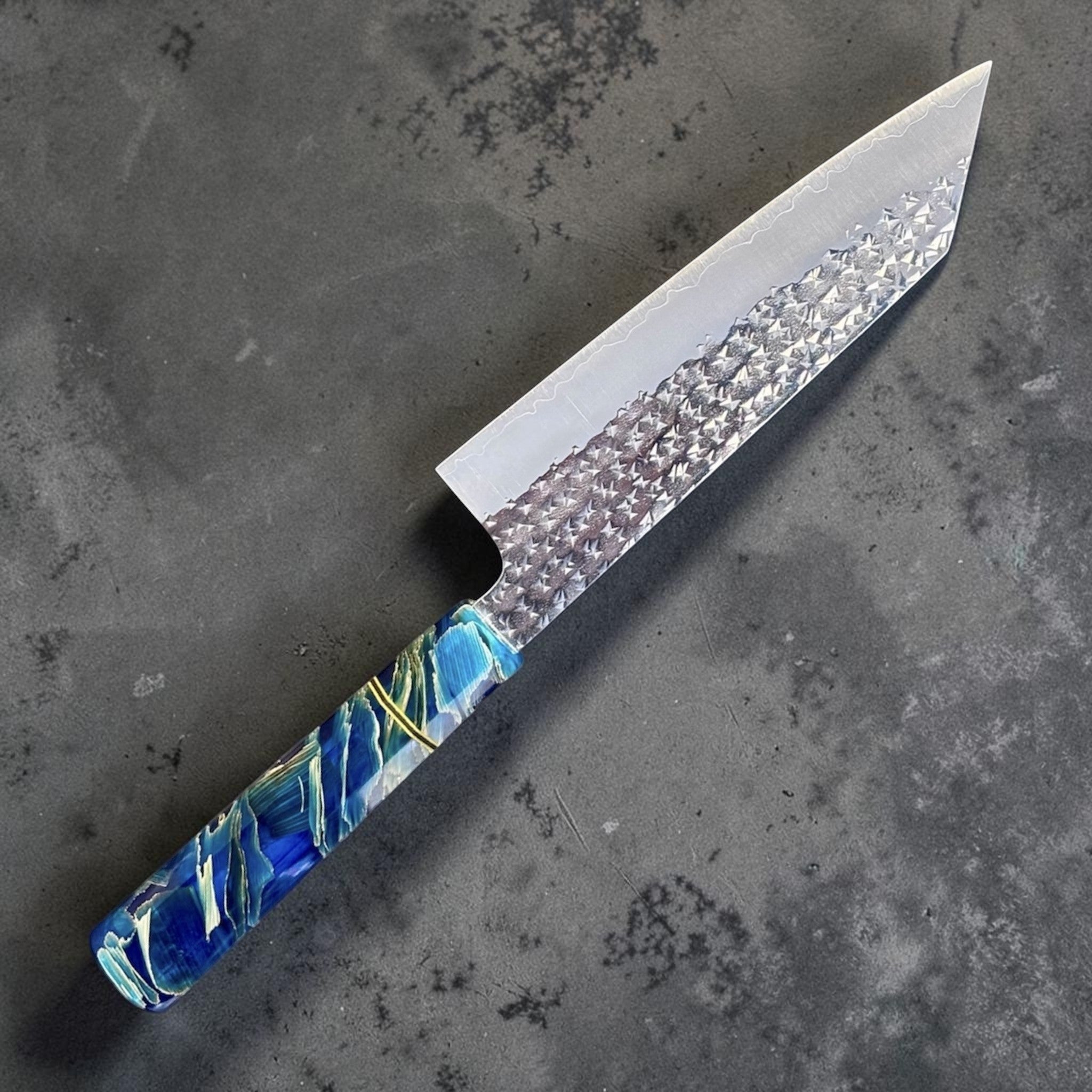 Yu Kurosaki Senko SG2 Bunka with Custom Blue Twistwood Prisma Knife Handle, angled product photo showing the hammered Senko SG2 bunka blade and blue Twistwood Prisma handle.