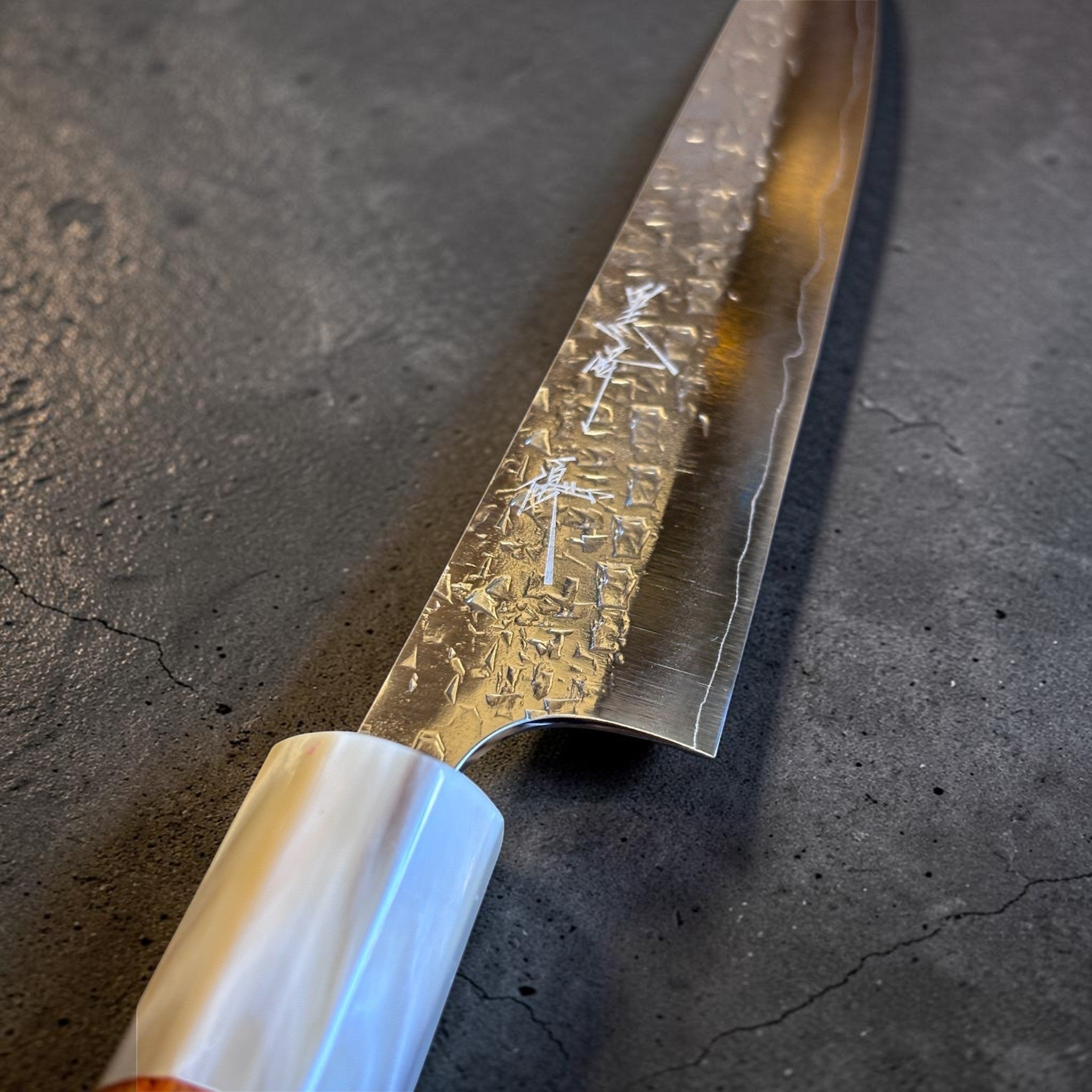 Yu Kurosaki Shizuku SG2 Petty 150 mm with Amboyna burl and buffalo horn ferrule, close-up of blade finish and kanji.