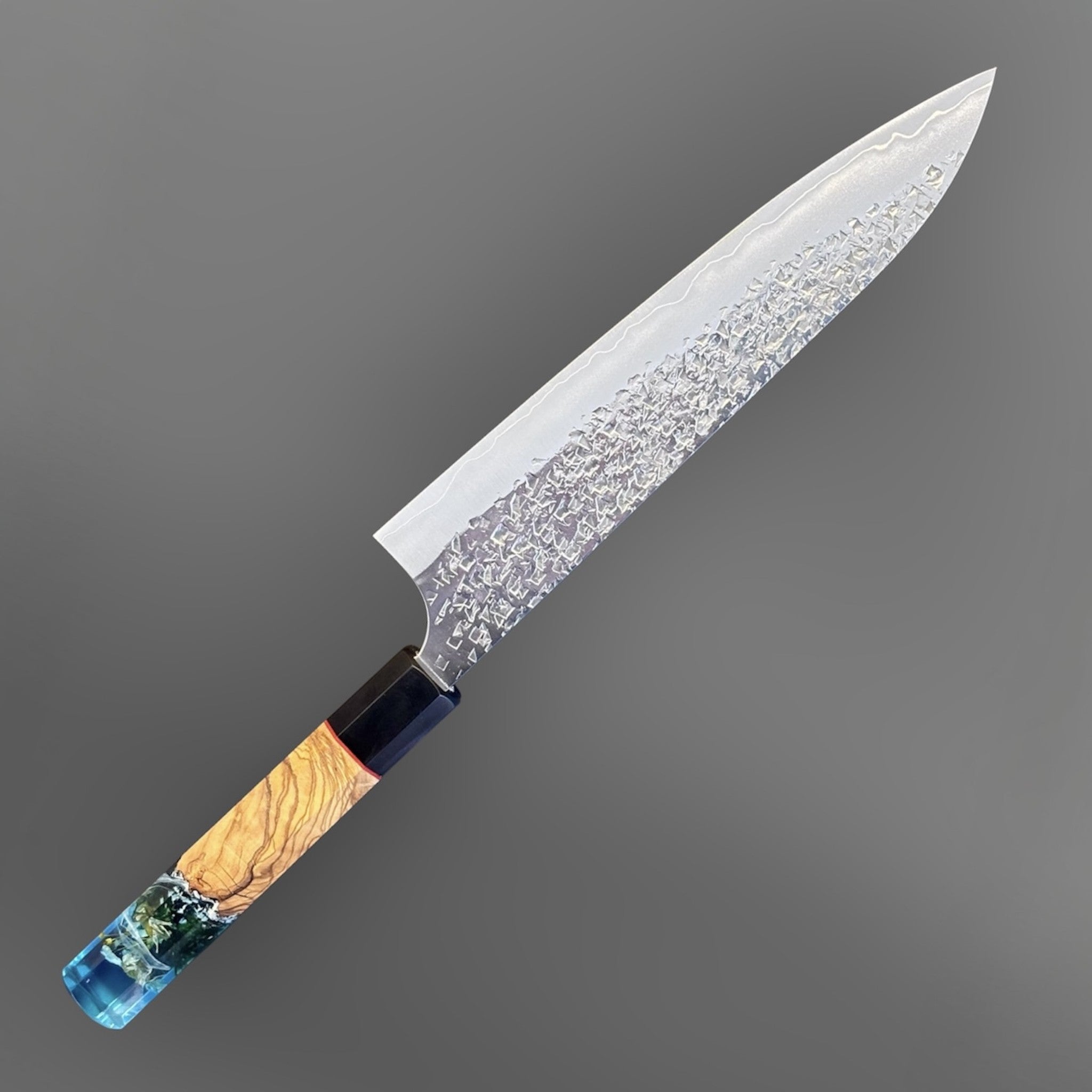 Yu Kurosaki Shizuku SG2 Gyuto 210 mm Custom with Prisma Knife Mountain Spring Handle, angled full-profile product photo showing the hammered Shizuku blade and custom Prisma Knife Mountain Spring handle.