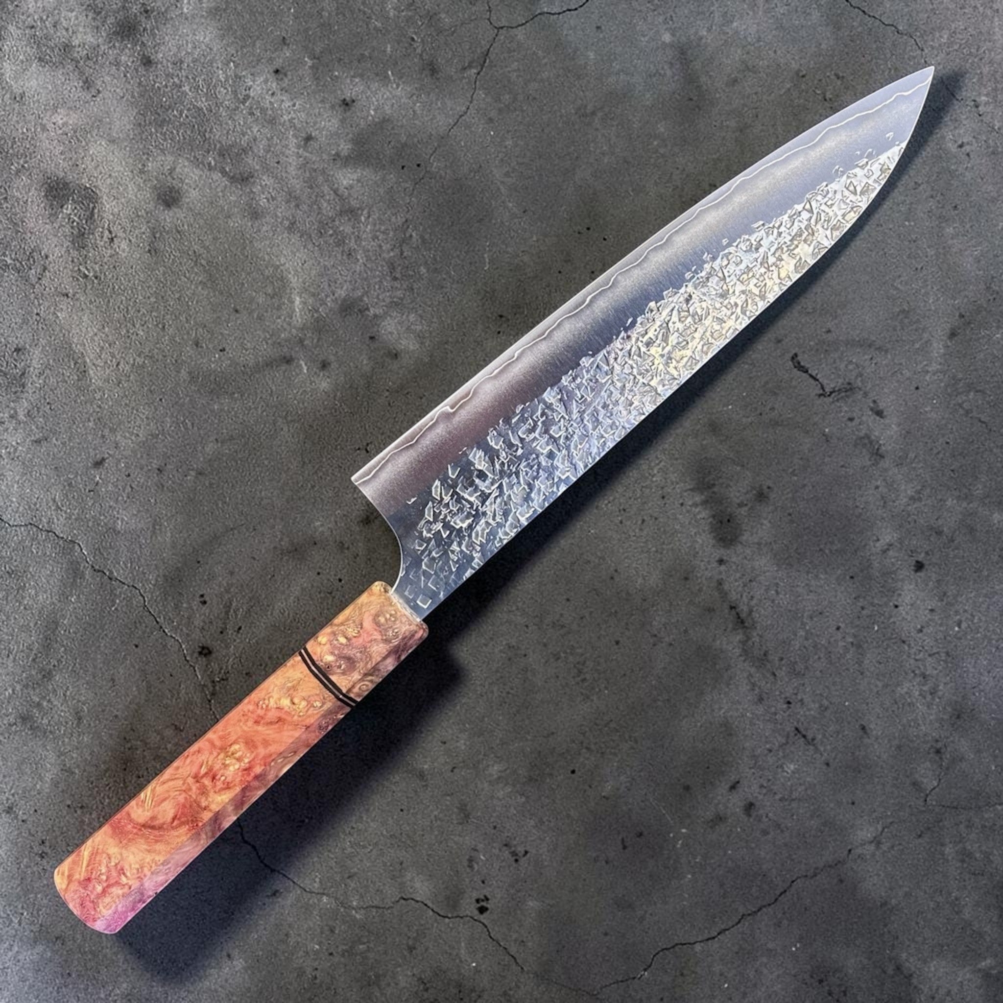 Yu Kurosaki Shizuku SG2 Gyuto 210 mm with Prisma Peachy Dream Handle, alternate angled product photo highlighting the SG2 blade finish and warm burl-style Prisma Peachy Dream handle.