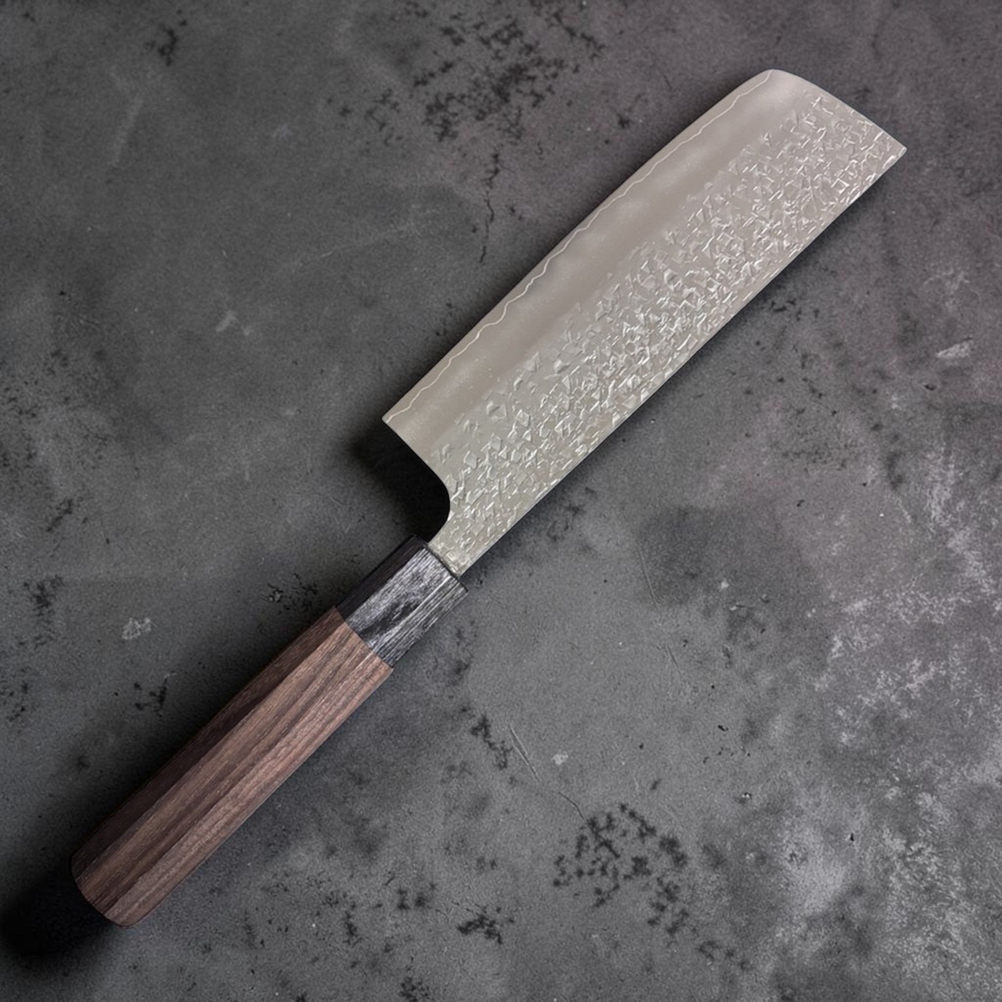 Yu Kurosaki Shizuku SG2 Nakiri 165 mm, left side blade view highlighting Shizuku hammered pattern and octagonal walnut handle.