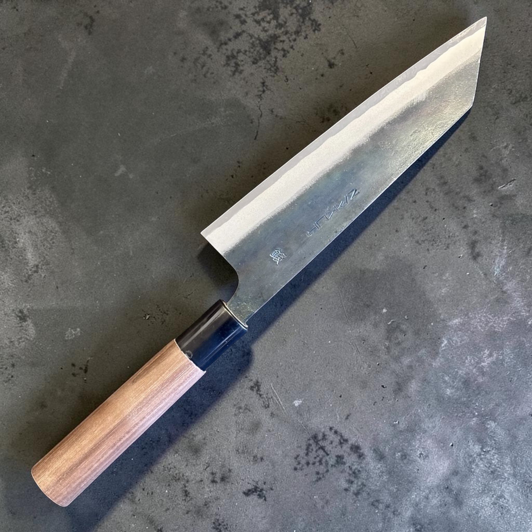 Zakuri AS Kurouchi Bunka 165 mm with kurouchi finish and wa handle, angled blade view showing the kurouchi finish.