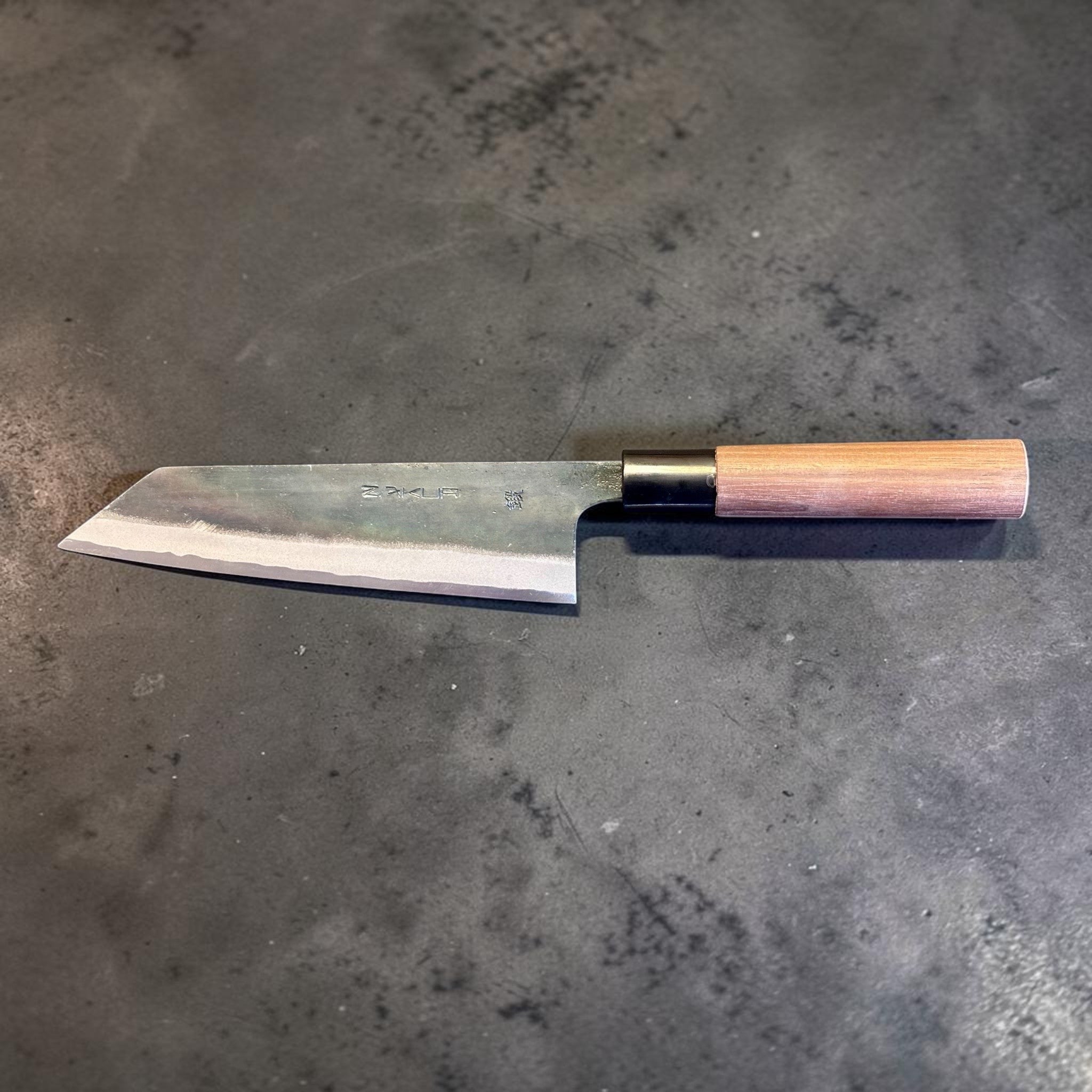 Zakuri AS Kurouchi Bunka 165 mm with kurouchi finish and wa handle, side profile showing blade shape and handle.