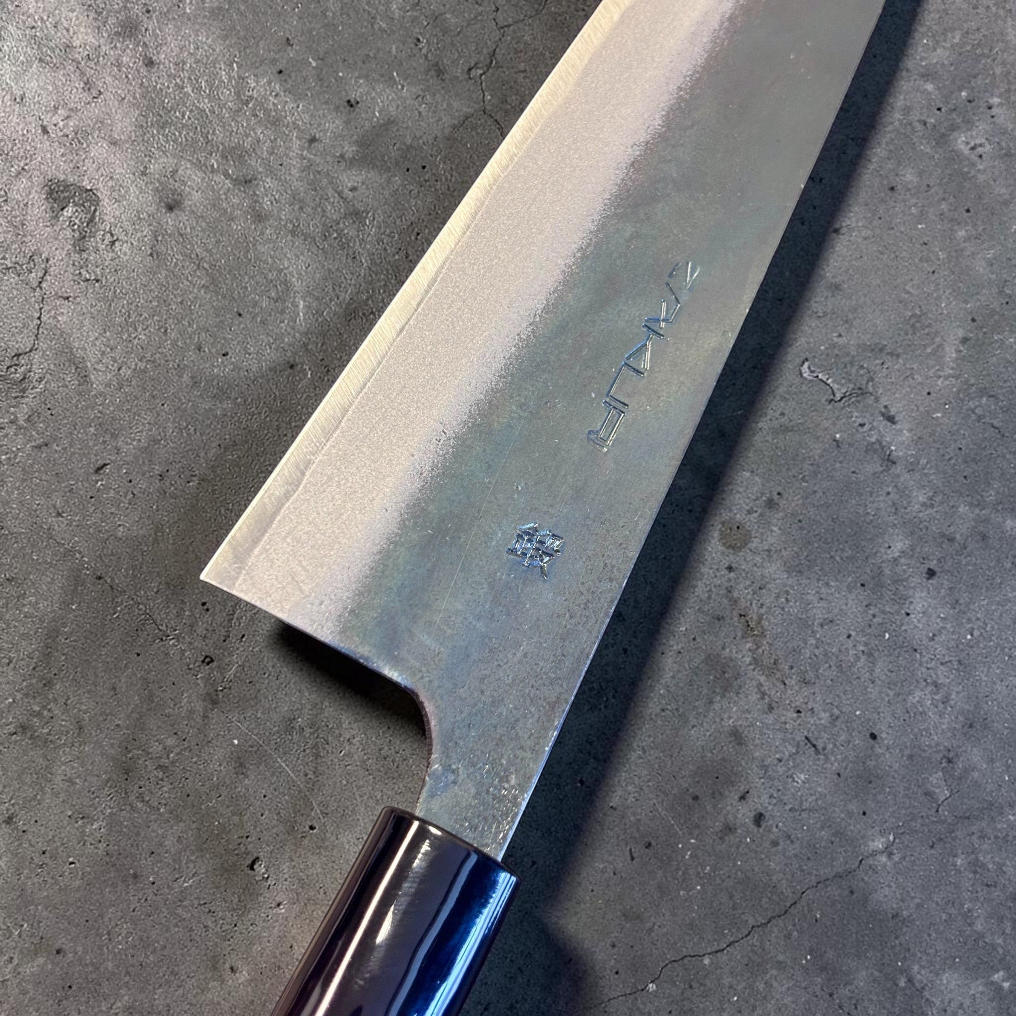 Zakuri AS Kurouchi Bunka 180 mm with kurouchi finish and wa handle, close-up of blade face and kanji.